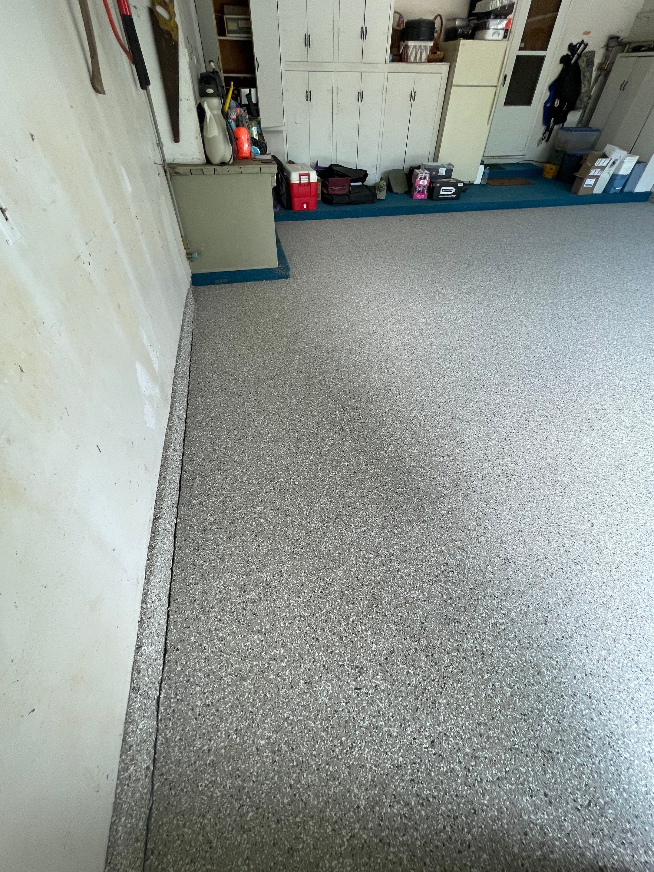 Custom Creekbed Garage Floor Coating in Sioux Falls by Select Painting, Coatings & Garage Cabinets