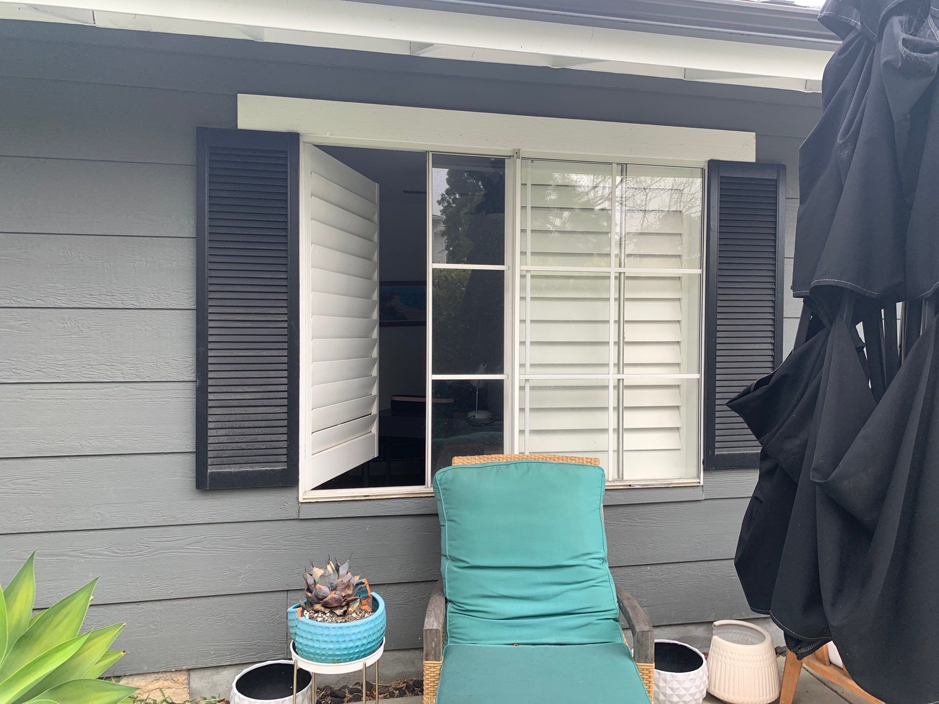 Window Installation using Milgard black vinyl windows by American Window Company