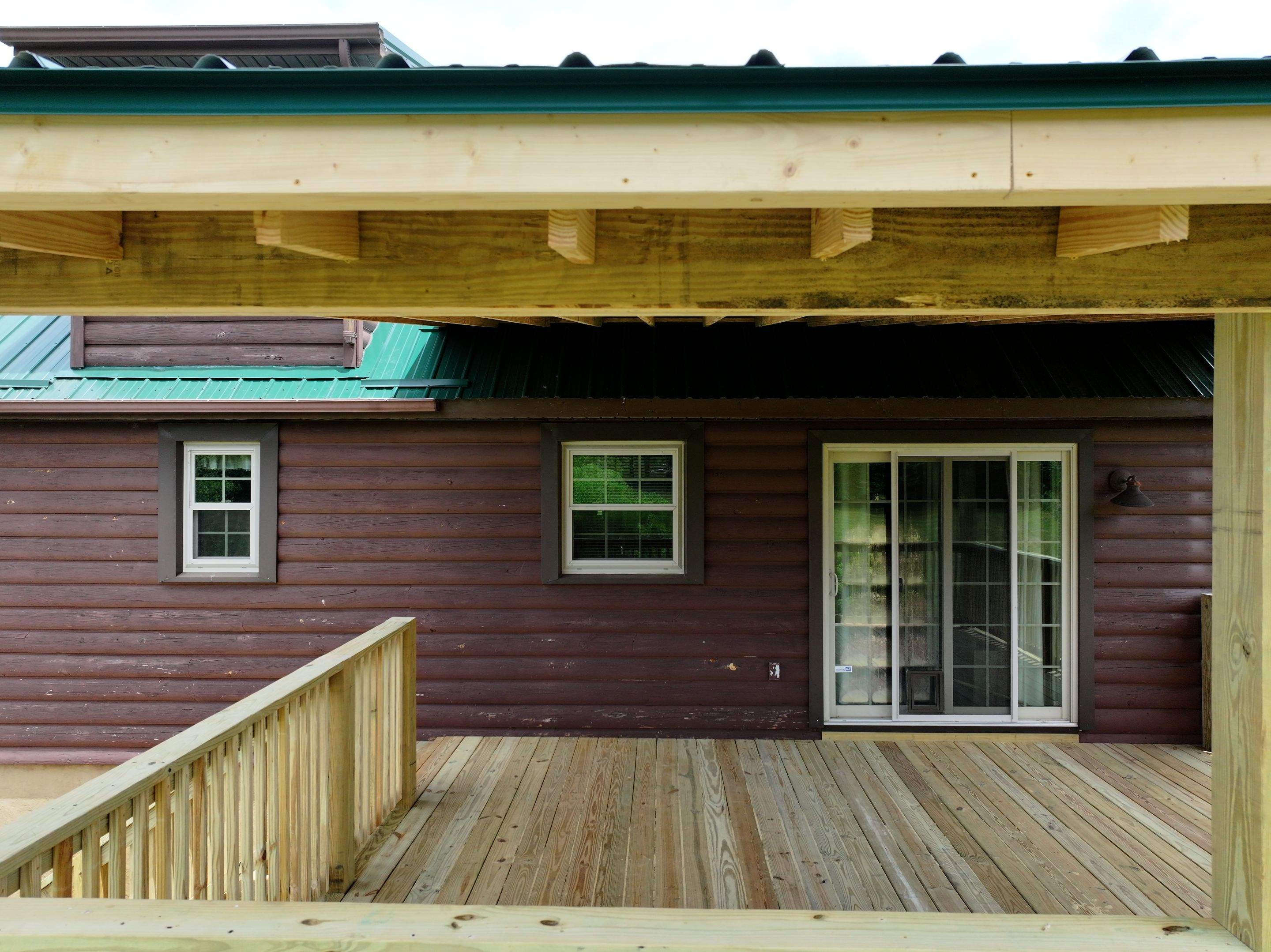 Paddle Creek Pet Ranch Cabin  by Omnia Roofing