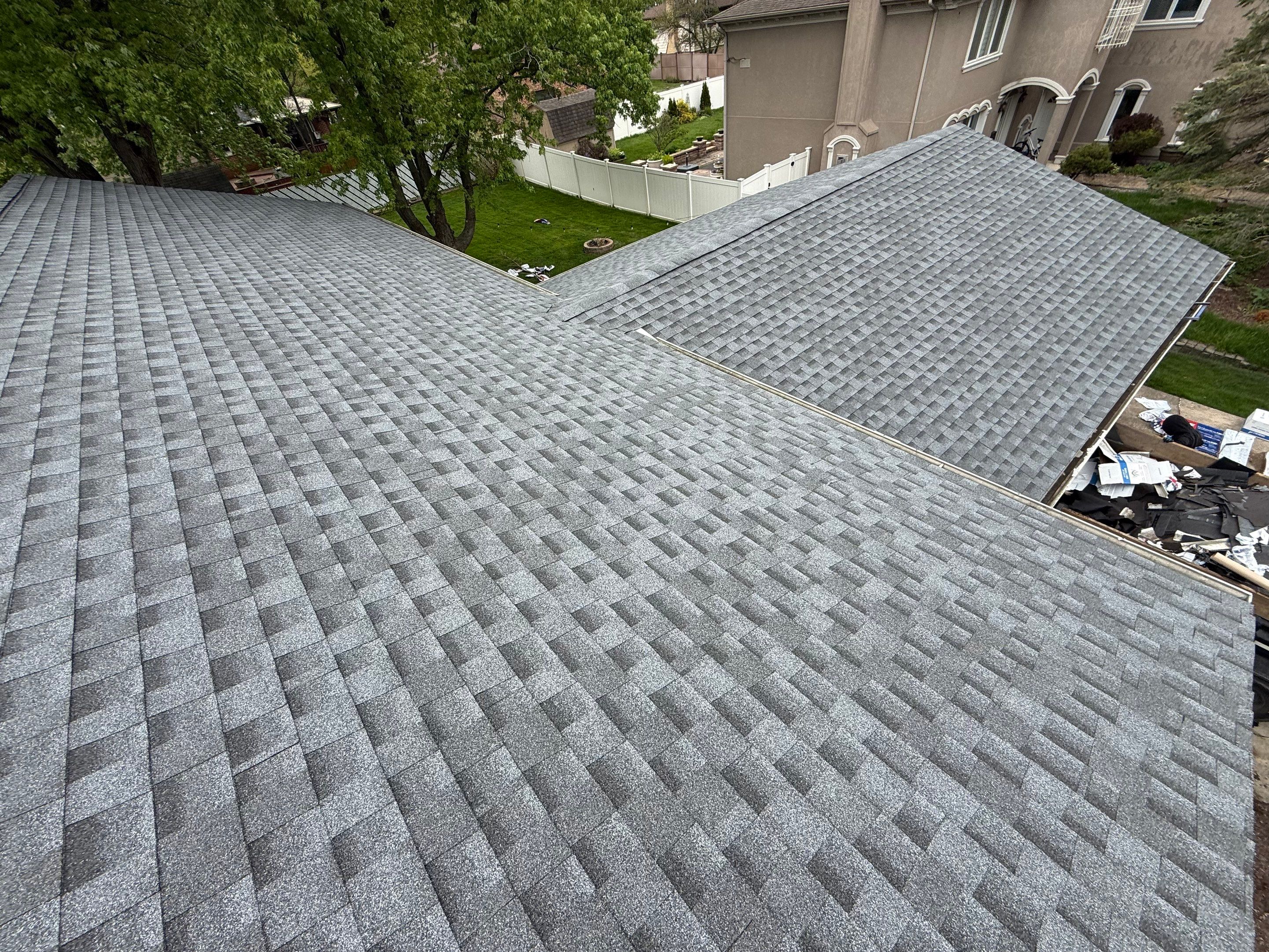 Roof replacement and chimney flashing by Optimal Home Improvement 
