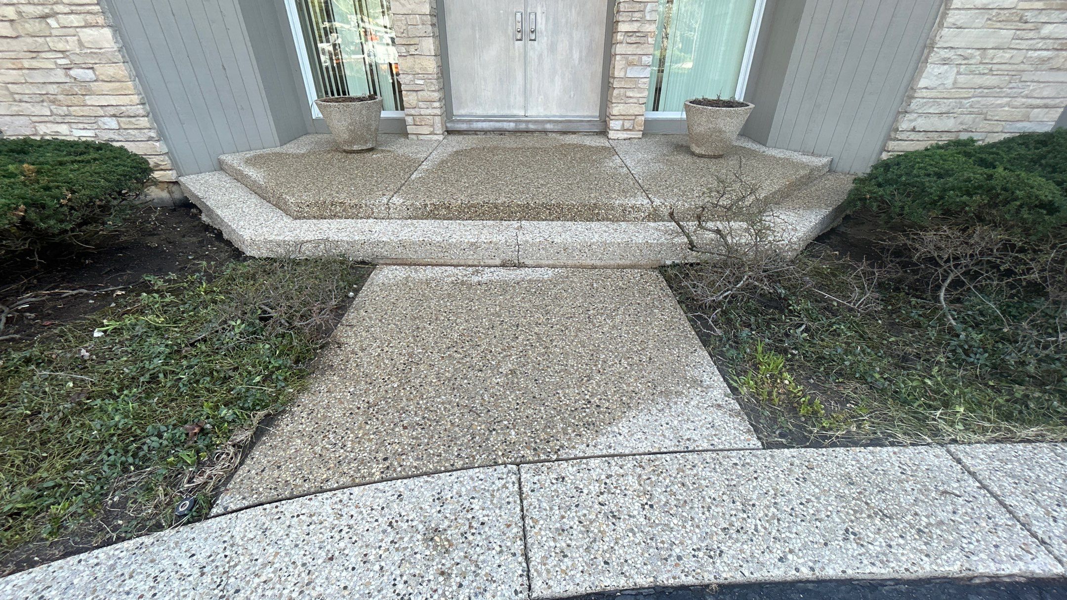 Aggregate Clean and seal using low gloss sealer by Northern Power Washing LLC.