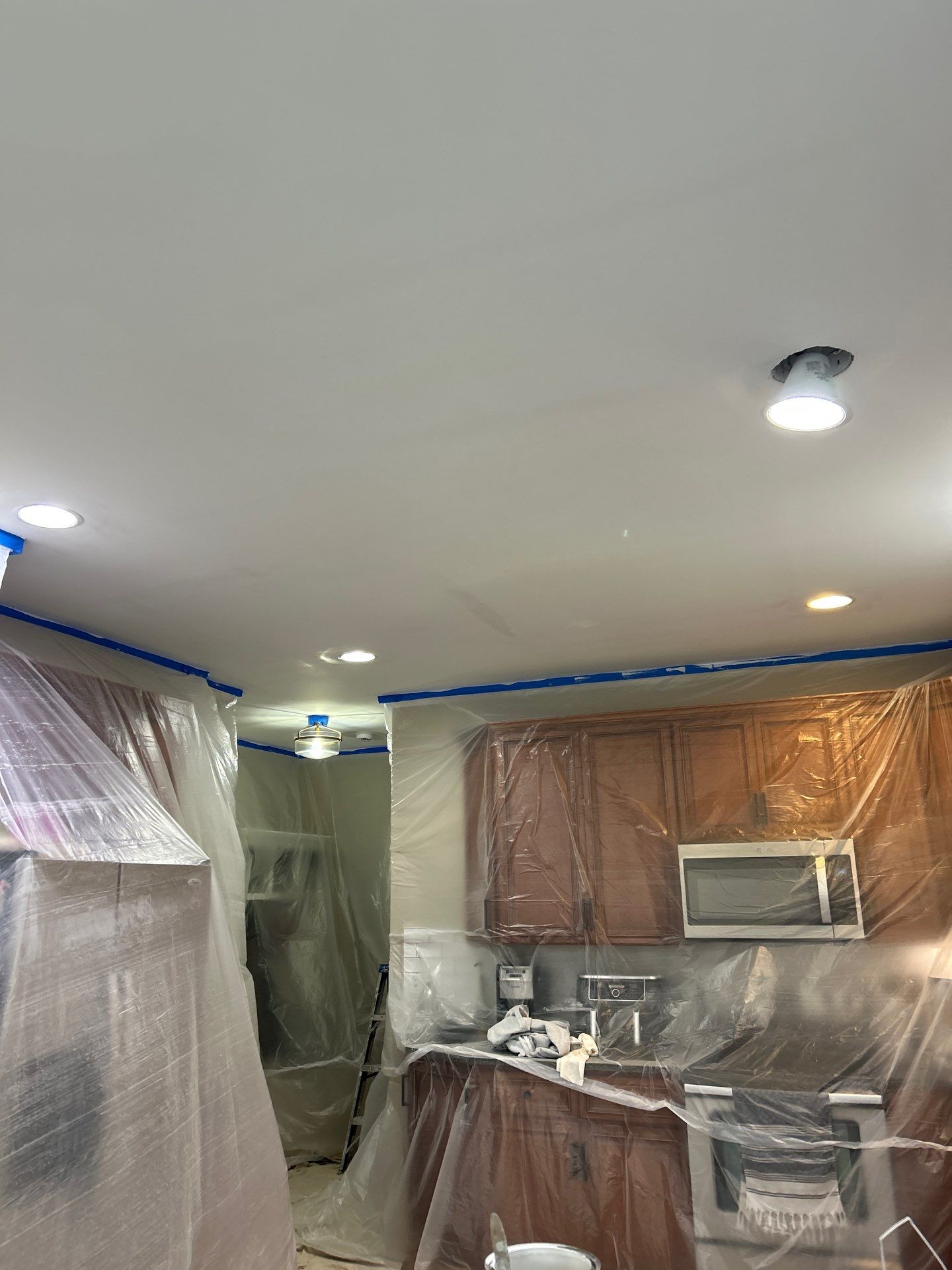 Drywall damage repair and repaint by GonzalezPainters & Contractors Inc 