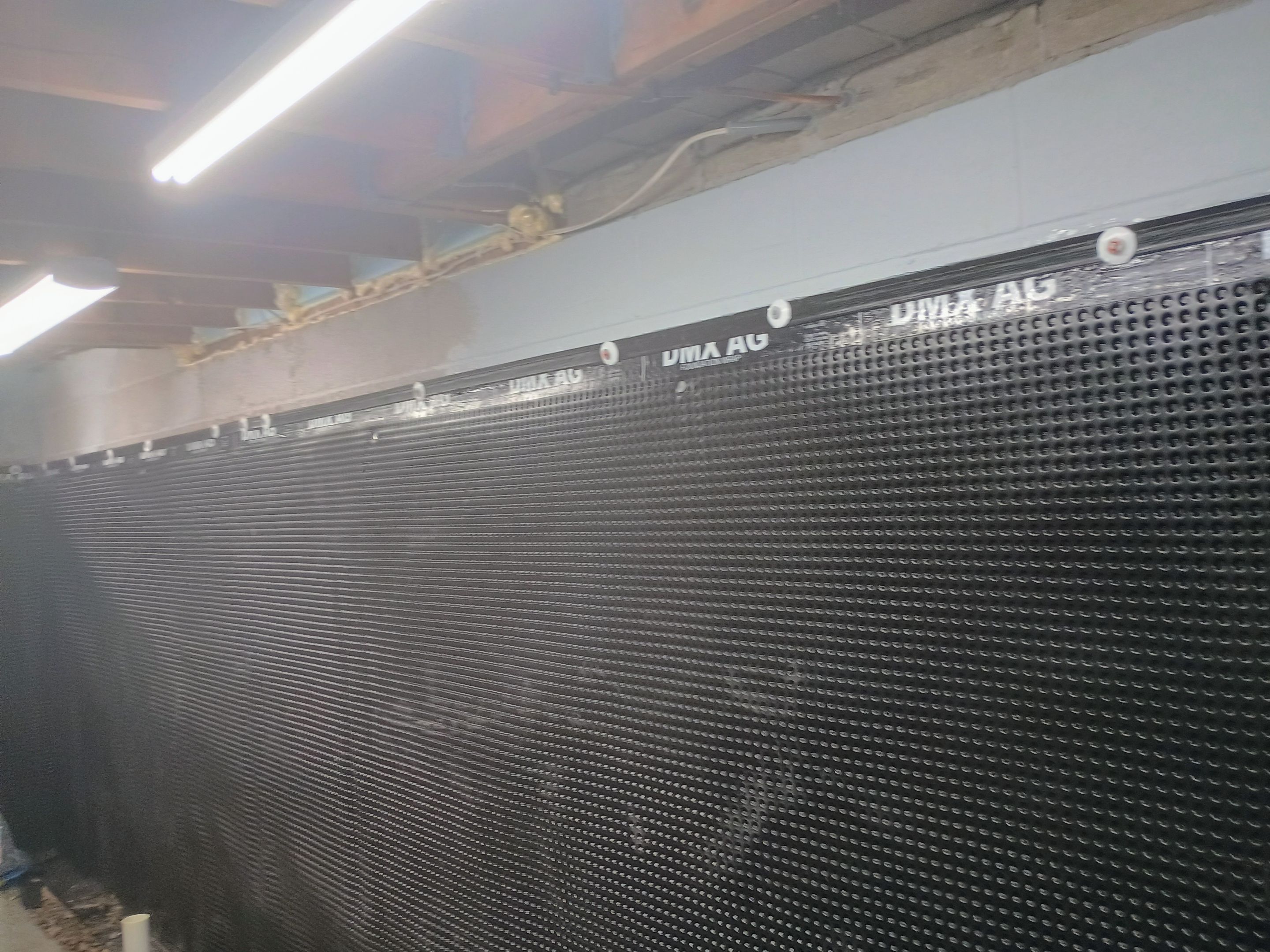 Depressurizing Denny's Basement Wall by Waterproofing Northeast