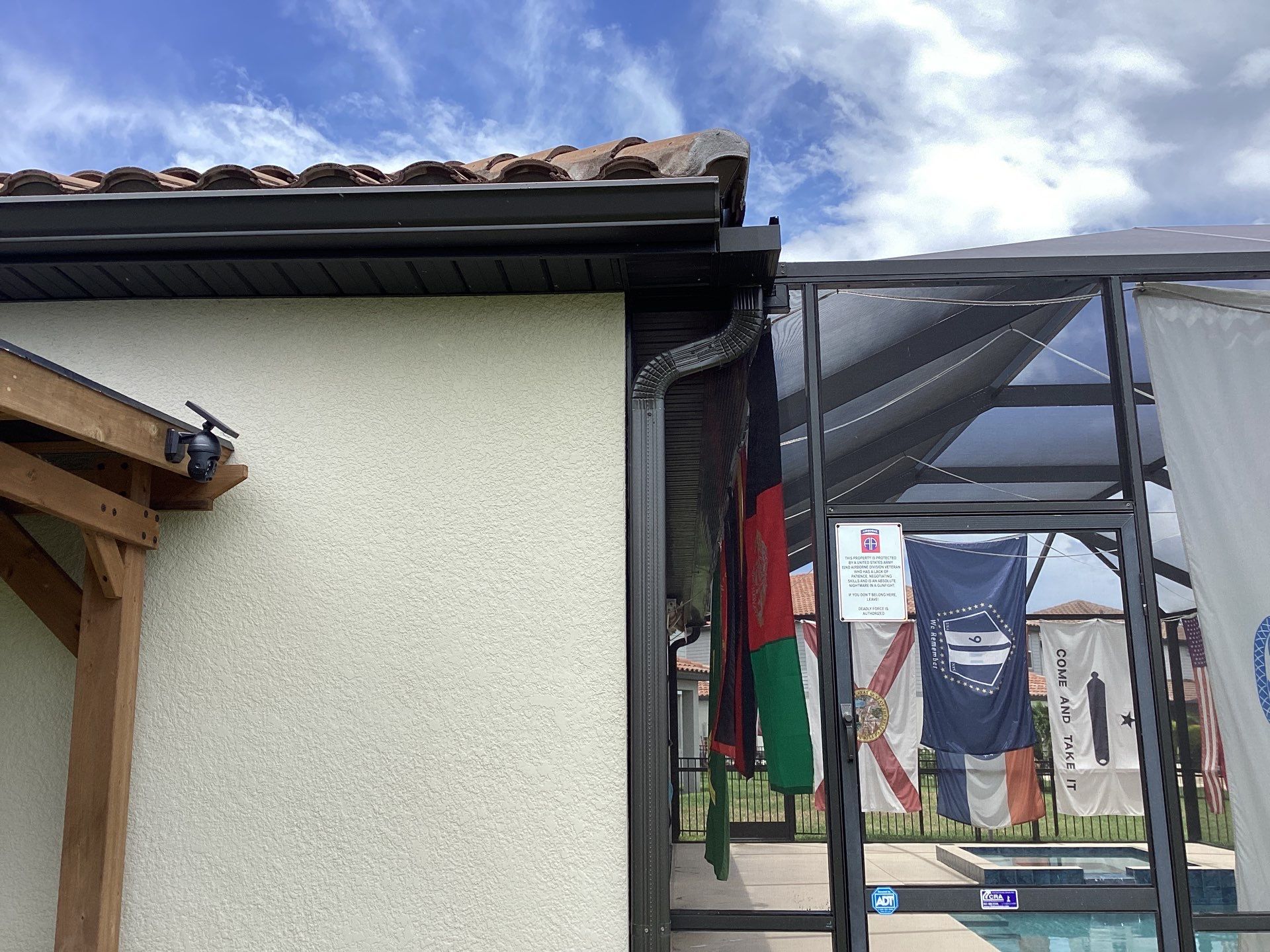 Musket brown seamless gutters with splash guards, new downspouts, and extensions in Bradenton, FL by Gutter Professors