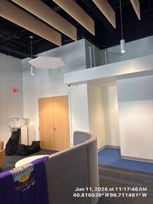 Modern Office Remodel Featuring Industrial Ceilings and Glass Partitions in Lincoln