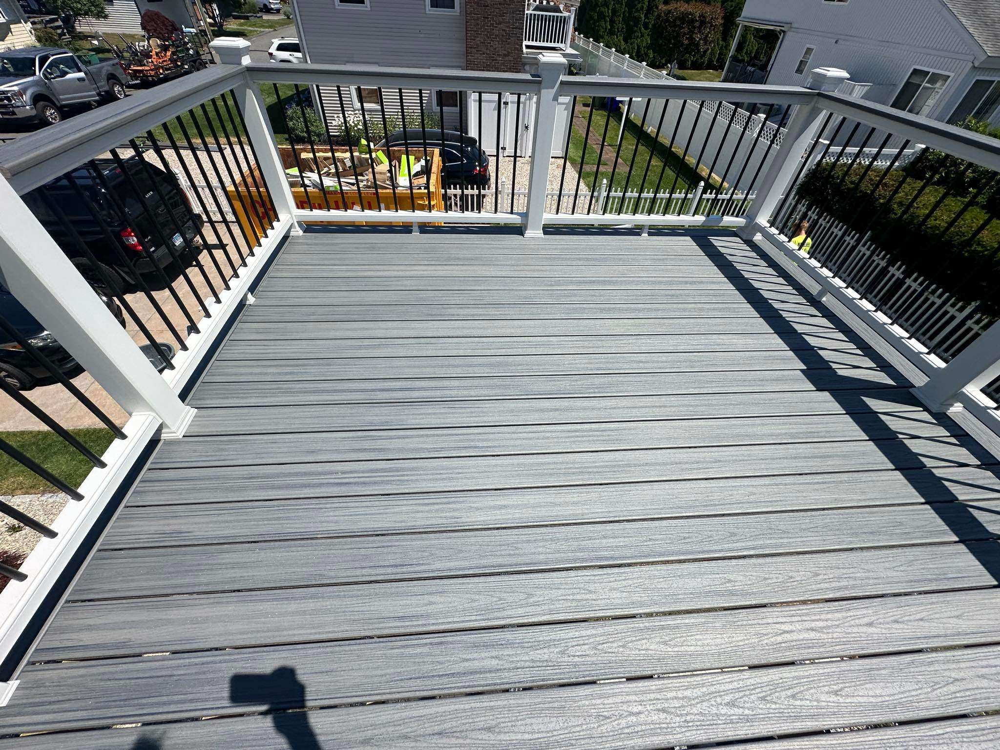Deck Replacement Trex Lineage Island mist decking and Matching cocktail rail, Wrapped posts and beam.  by DiGiorgi Roofing and Siding Inc