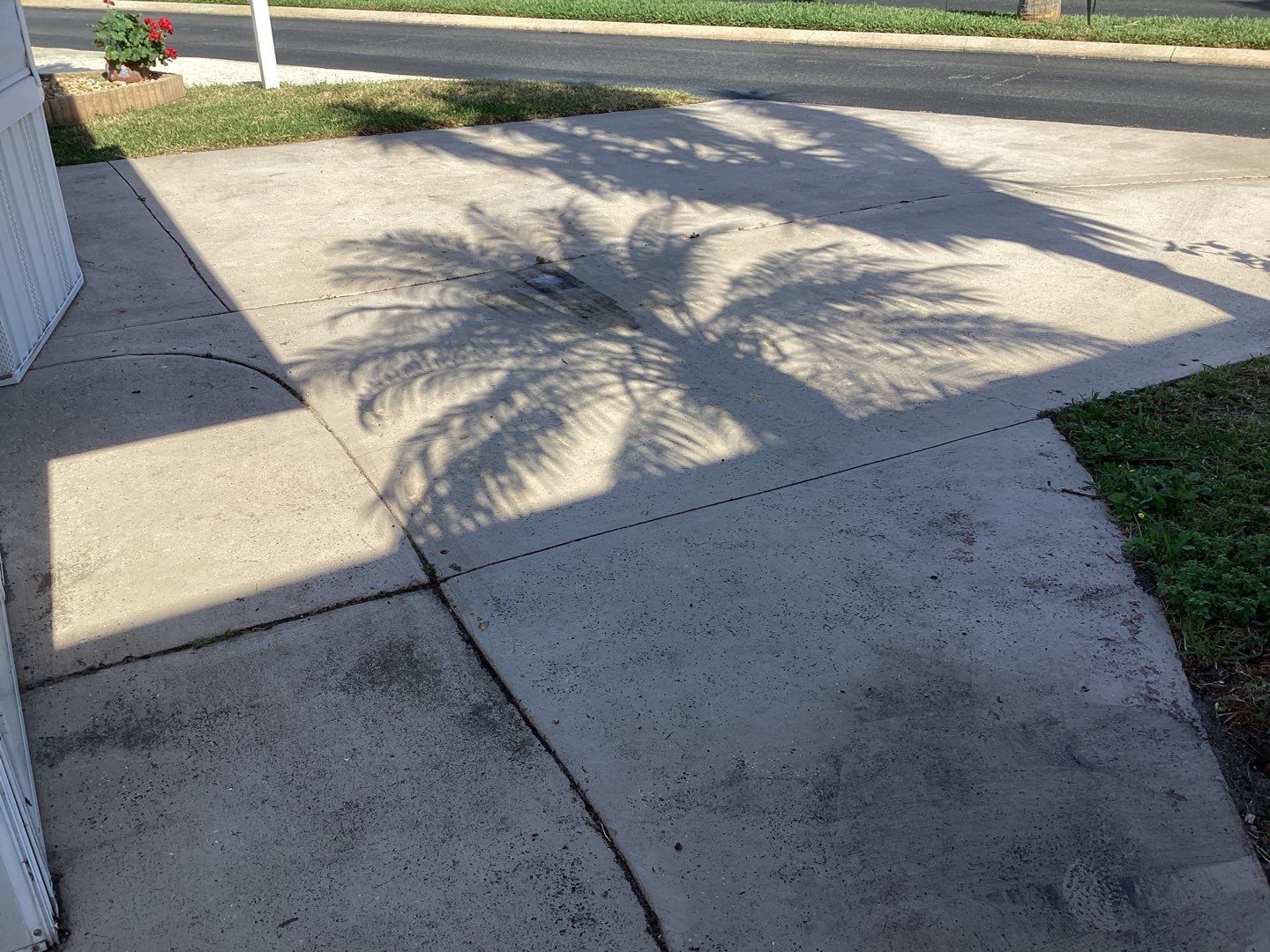 Driveway using Pebble Beach by Amvet concrete coatings llc