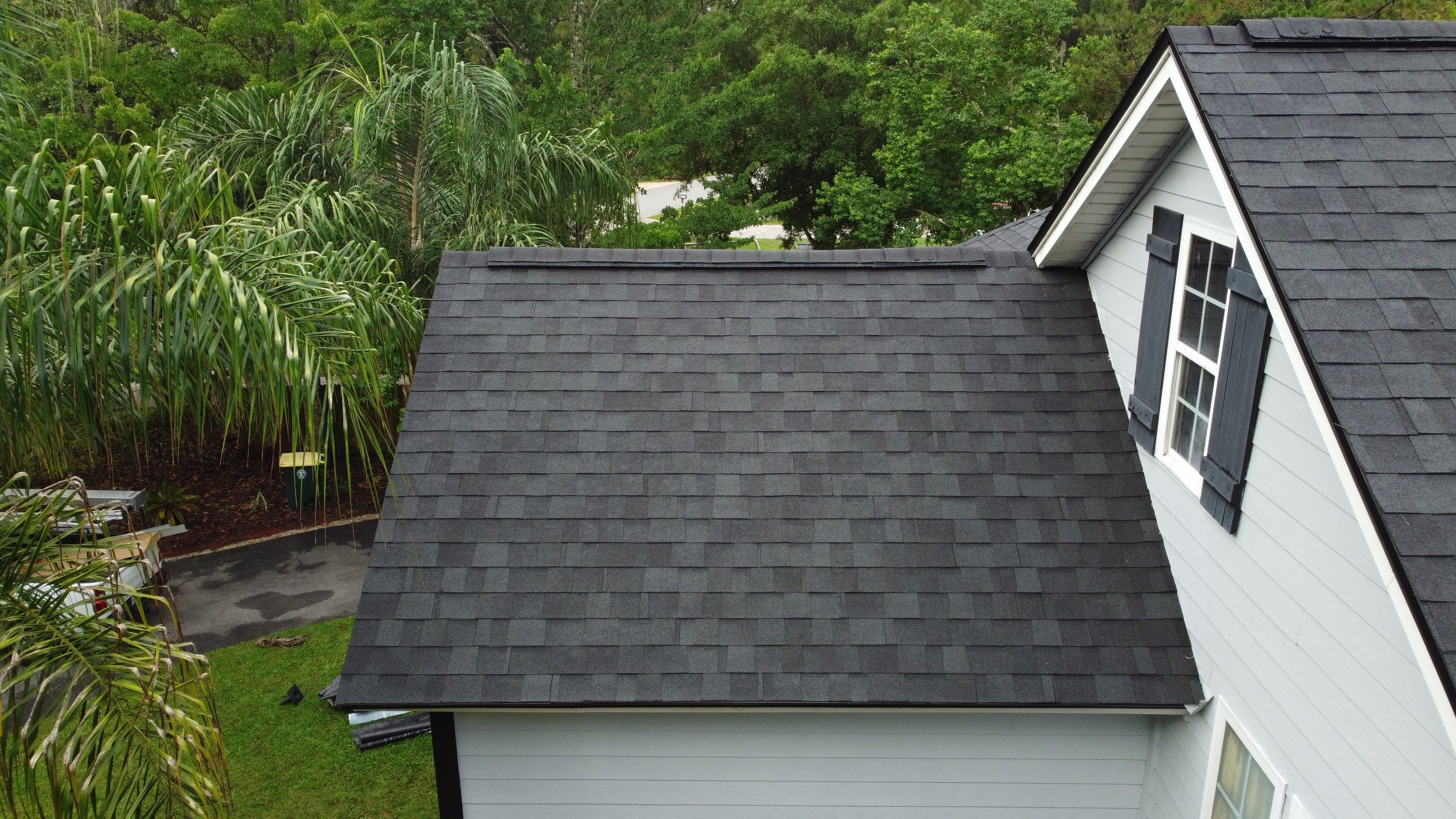 Complete Onyx Black Asphalt Shingle Roof Replacement and Skylight Installation in Jacksonville by Trinity Restoration and Roofing LLC