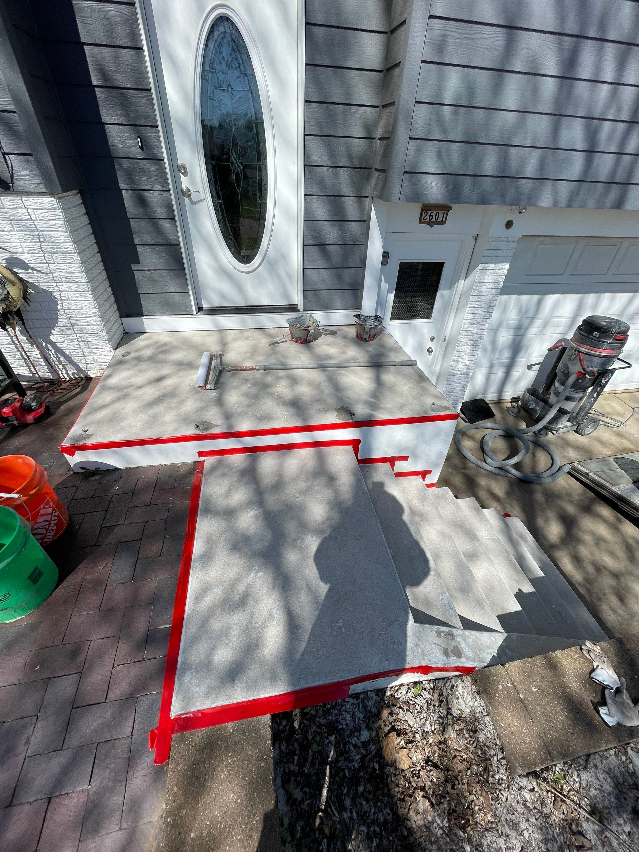 Grey Polyaspartic Porch and Stair Resurfacing in Sioux Falls by Select Painting, Coatings & Garage Cabinets