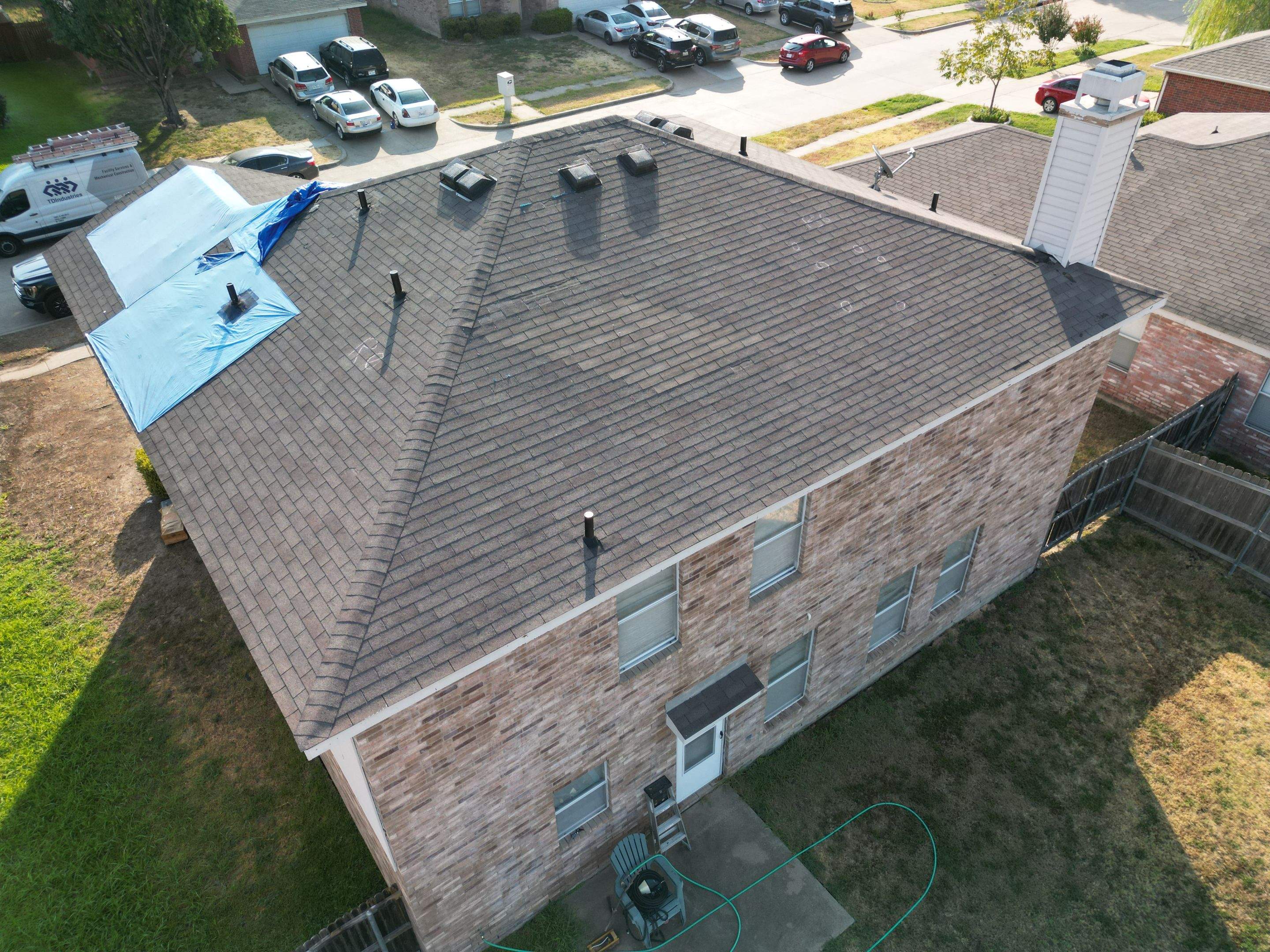 Full Roof Replacement, Chimney Rebuild and Interior Damage Replacement by First United Roofing & Construction
