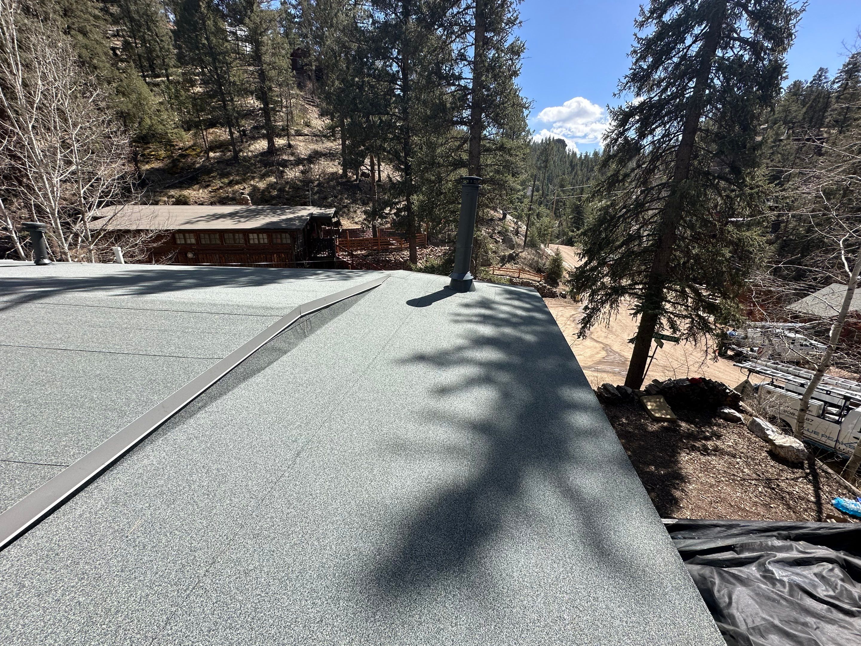 Residential Roofing Installation using Modified Bitumen Roofing by Blue Peaks Roofing LLC 