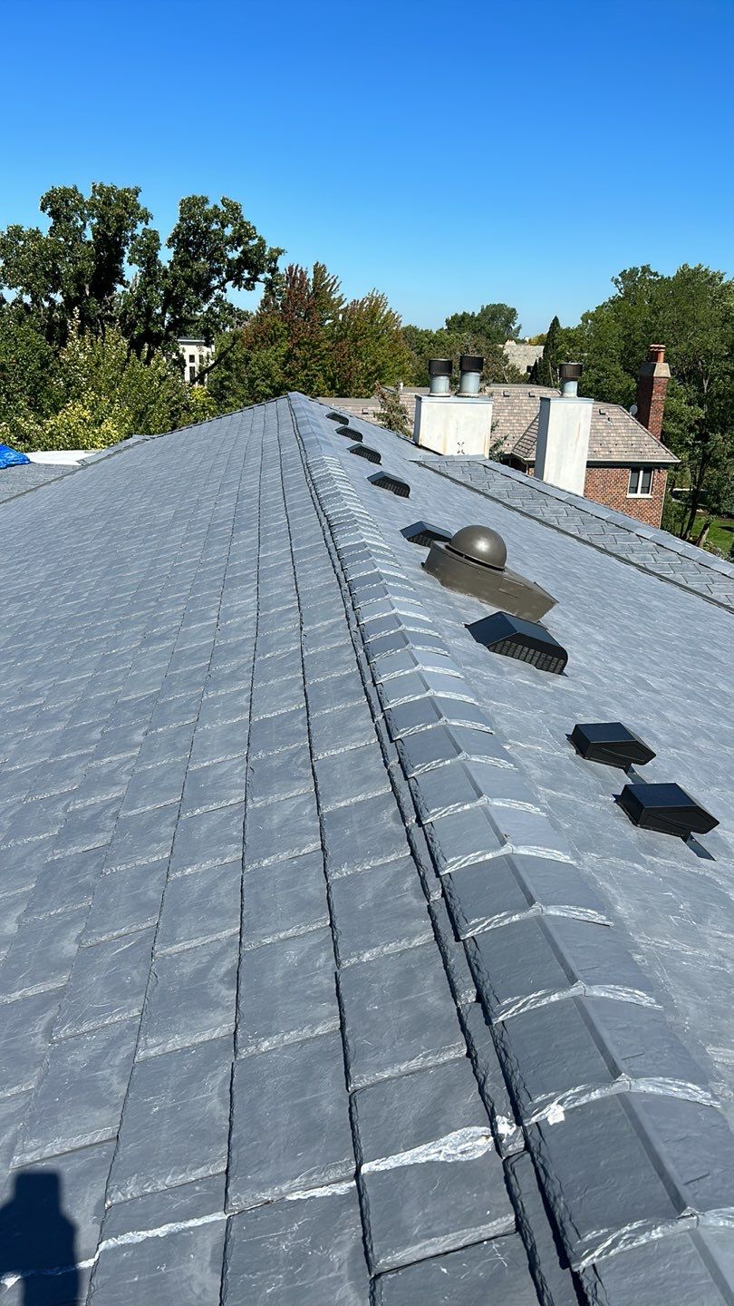 DaVinci Slate Roof Installation and Aluminum Gutter by Custom Installations