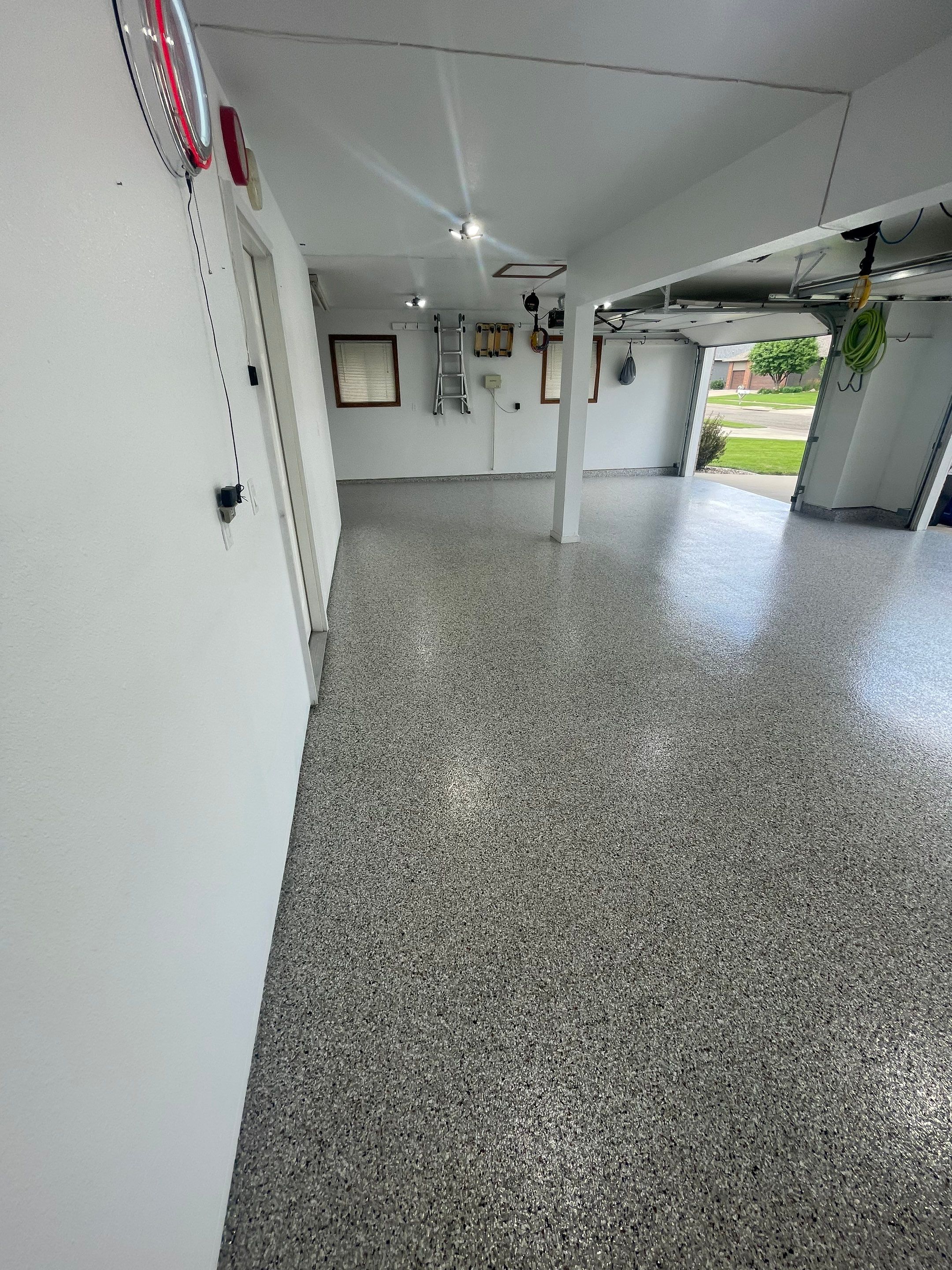 Multi-Car Garage Concrete Coating with Coyote Flake Finish in Sioux Falls by Select Painting, Coatings & Garage Cabinets