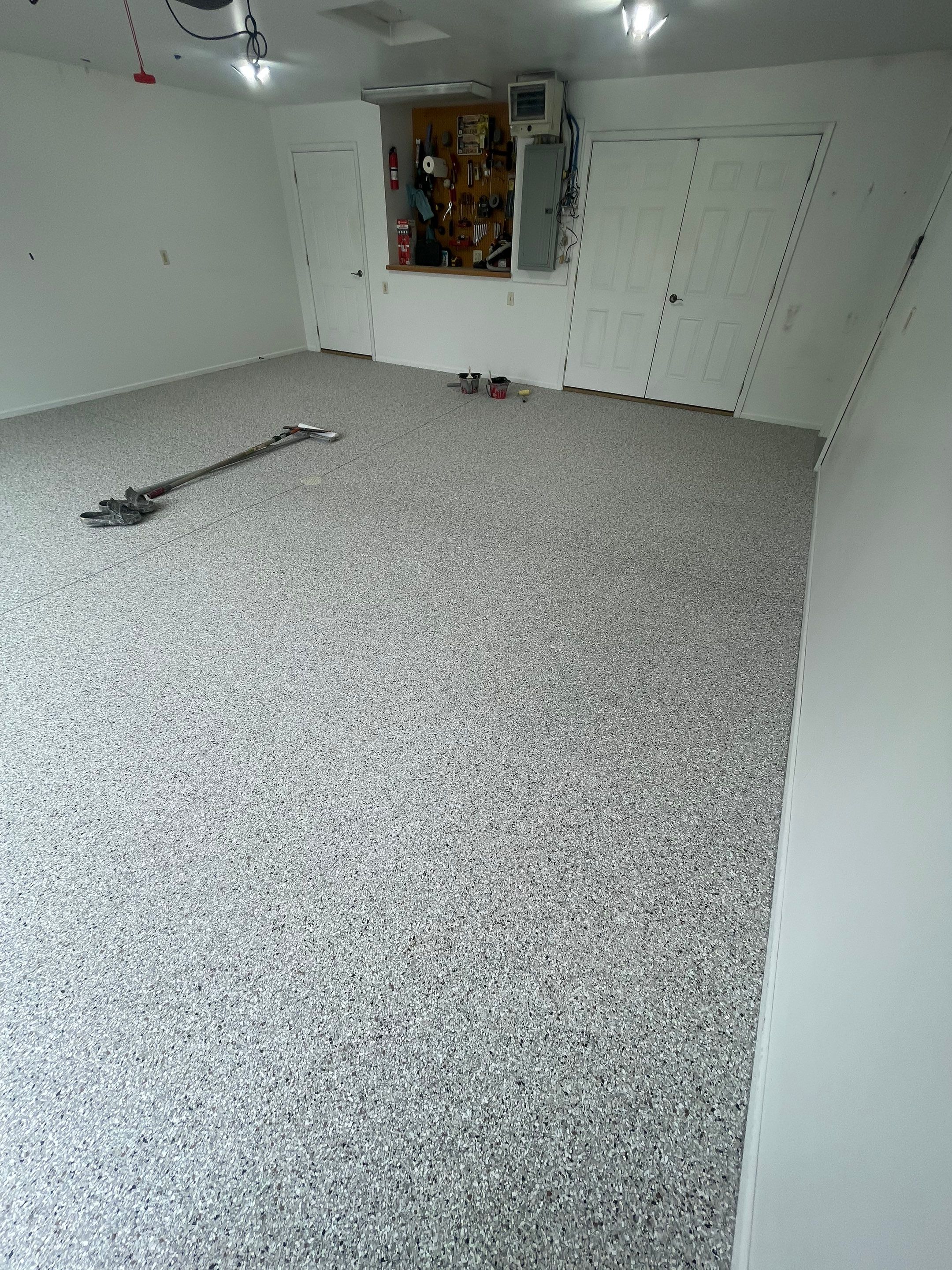 Coyote Flake Garage Floor Coating in Worthington, Minnesota by Select Painting, Coatings & Garage Cabinets
