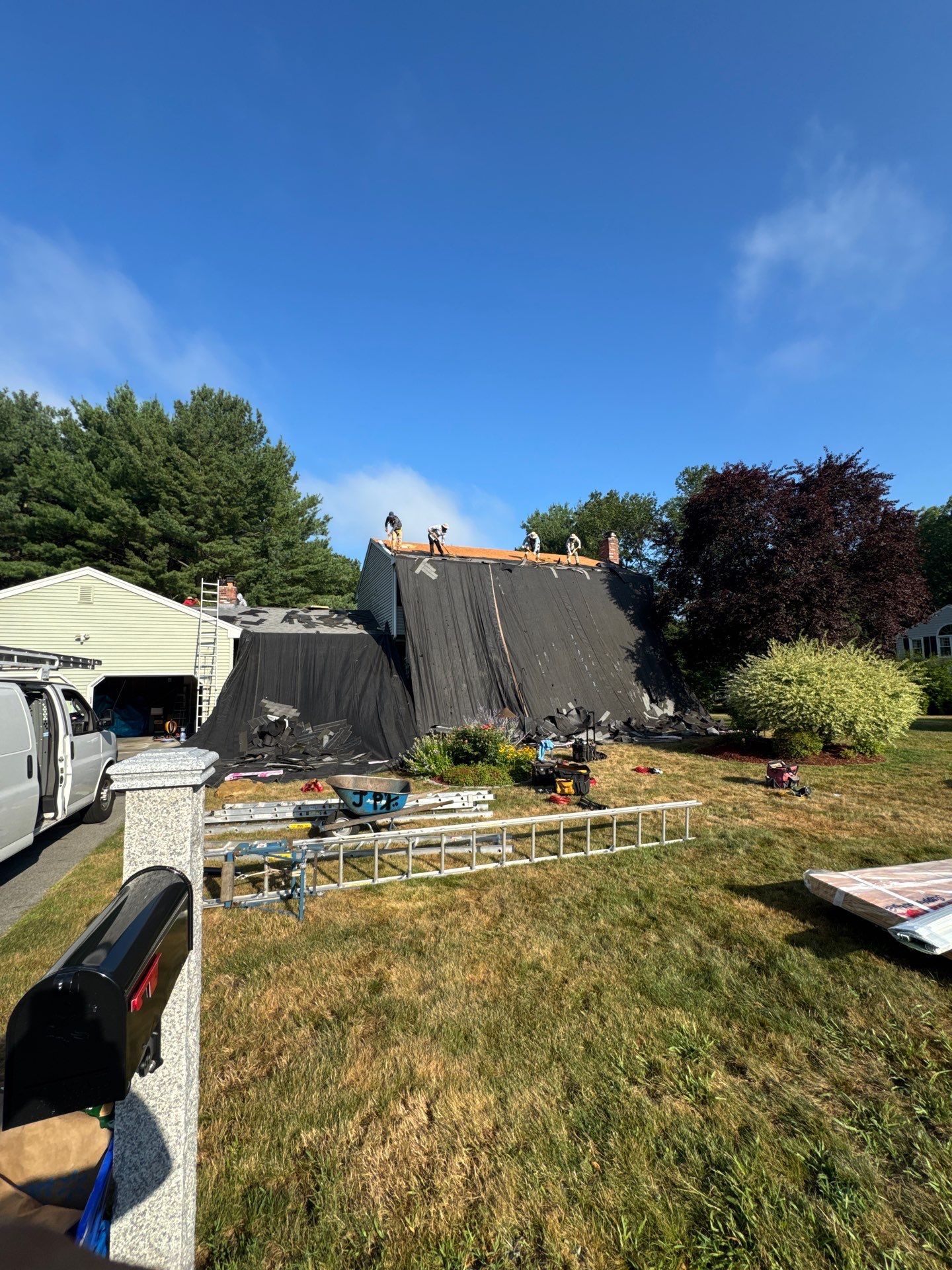 Complete Roof Replacement with Chimney Flashing, Gutter Guard System, and Vinyl Siding Repairs by Mighty Dog Roofing of Greater Middlesex County