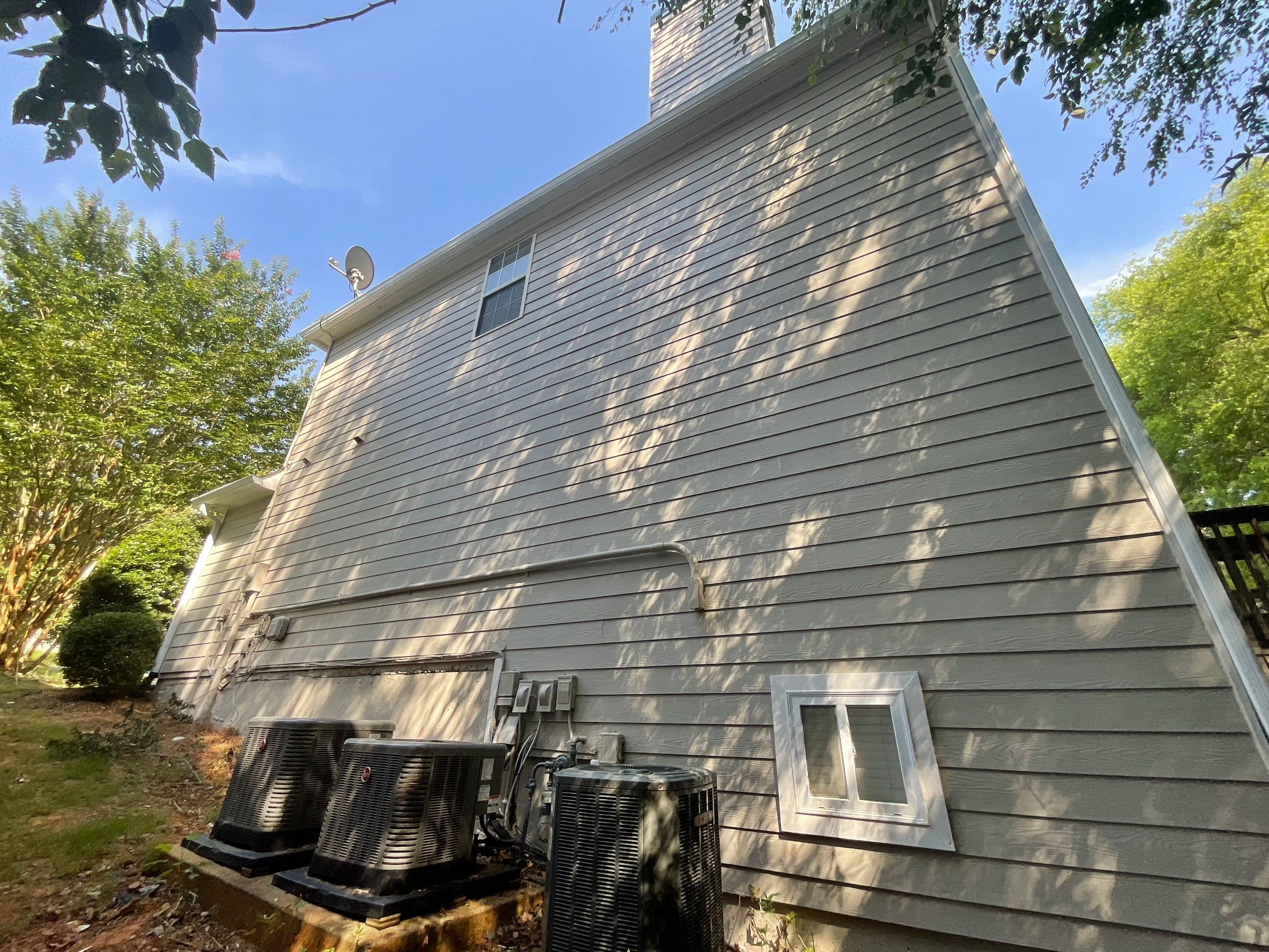 Stucco and Siding Exterior Painting with New Gutters in Kennesaw by Swift Home Renovations