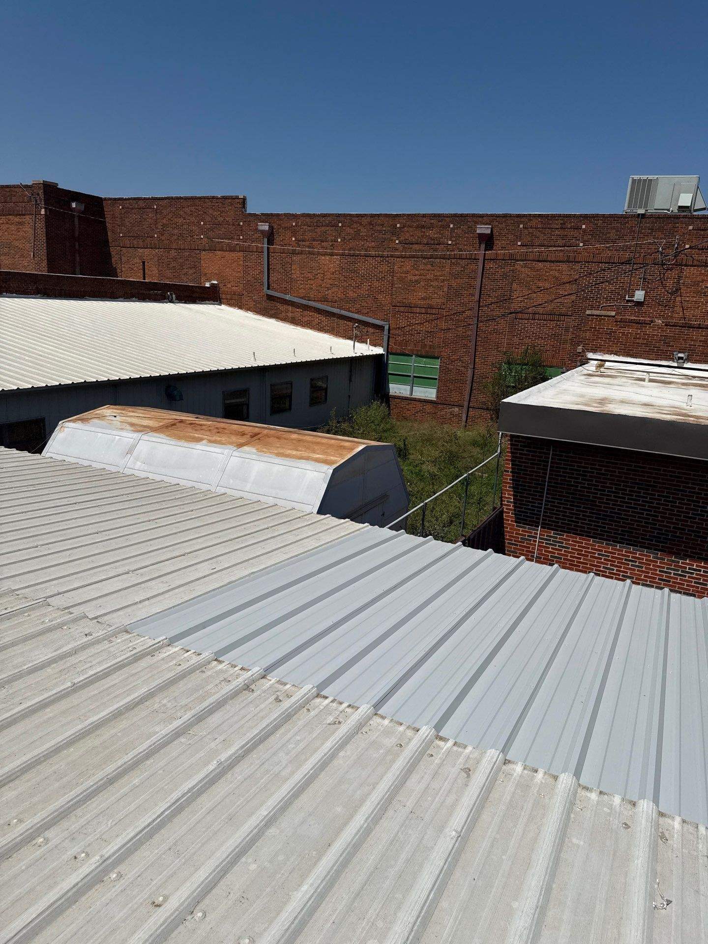 Hollis High School Comprehensive TPO Roof Replacement and Restoration by Secondary Rhodes