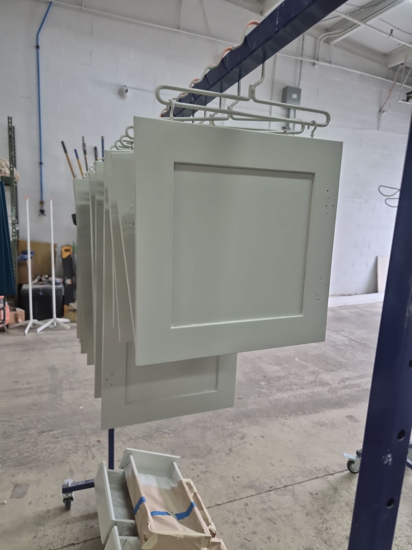 Two-Tone Kitchen Cabinet Refinishing and Granite Countertop Installation by Top Shelf Painter