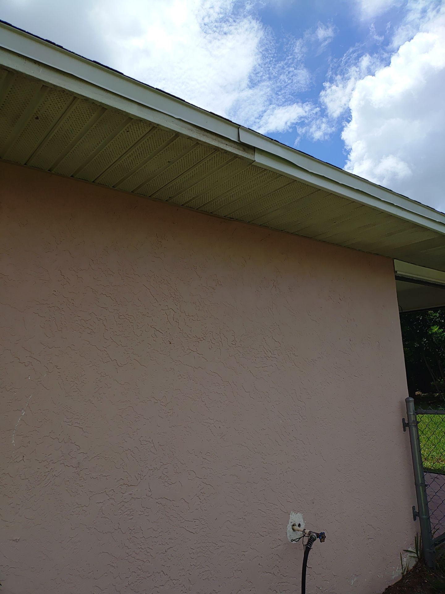 Replace gutter using White Down Spouts in Cape Coral FL by Gutter Professors