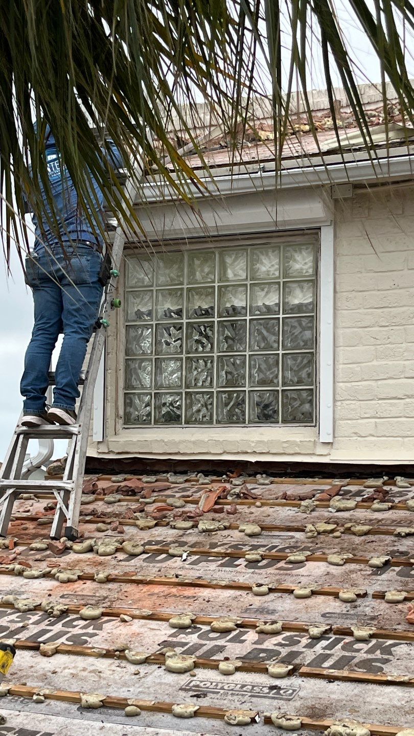 Off with the Tile and on with the TILCOR stone coated metal.  by Bayfront Roofing and Construction