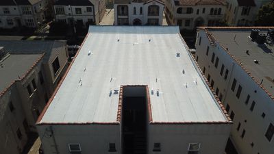 Apartment Building Reroofing using Polyfresko® G Highly Reflective Modified Bitumen Cap Sheet