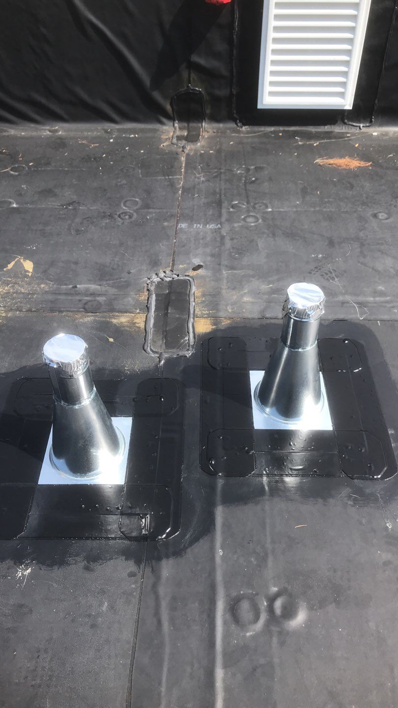 Commercial Roofing Installation using EPDM with white gutters by A Plus Exterior