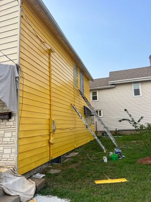 Brightening the exterior of this home with a fresh coat !!
