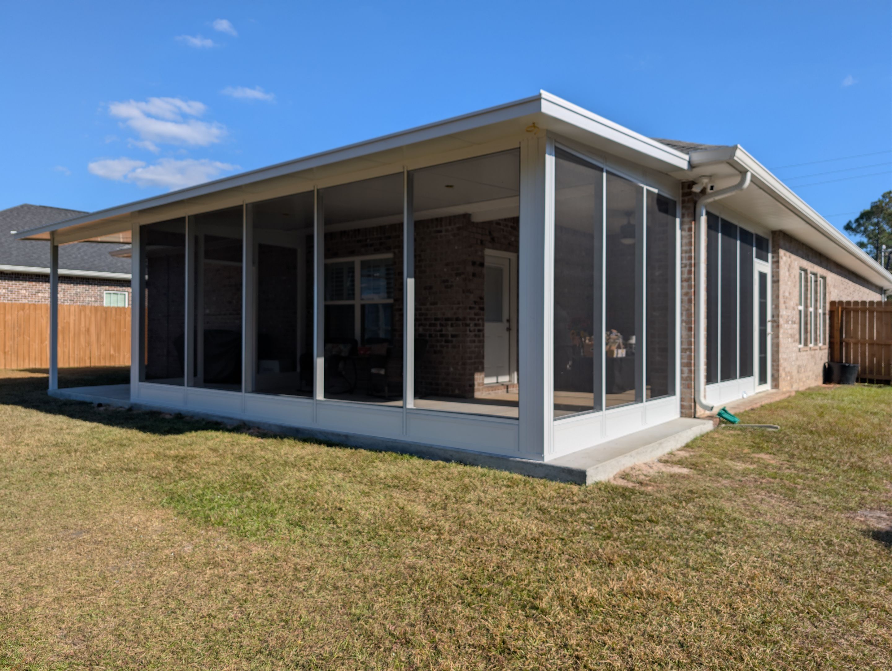 Home addition w/Vinyl 4-Track Windows by Titan Sunrooms