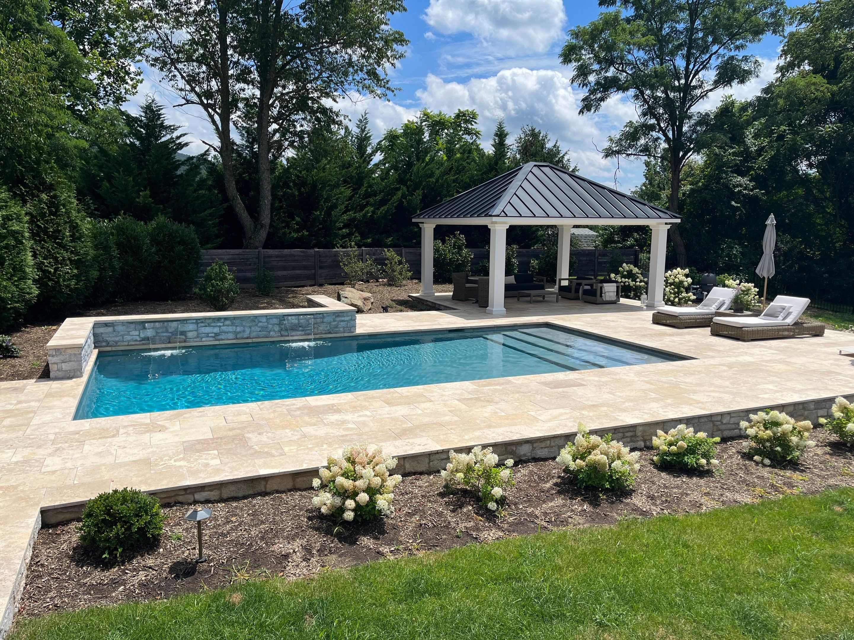 Gunite Pool w/ Raised Wall and Waterfalls by Elysium Pools