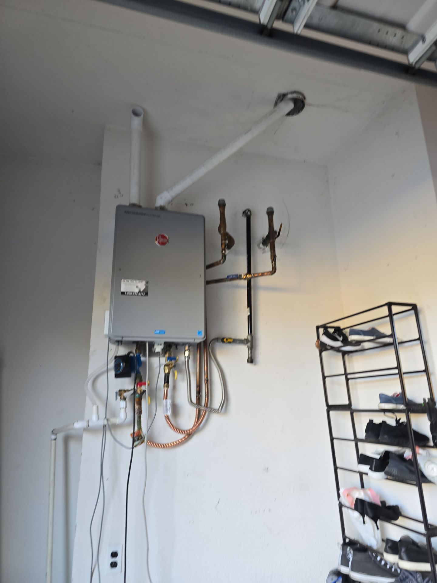 Installing a New Tankless Water Heater by Us Plumbing