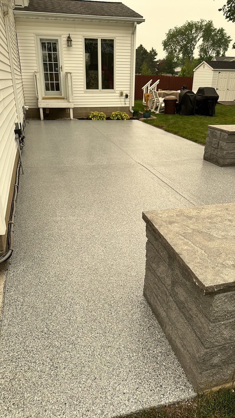 Silverado garage floor and patio coating  by NG Masonry & Construction LLC