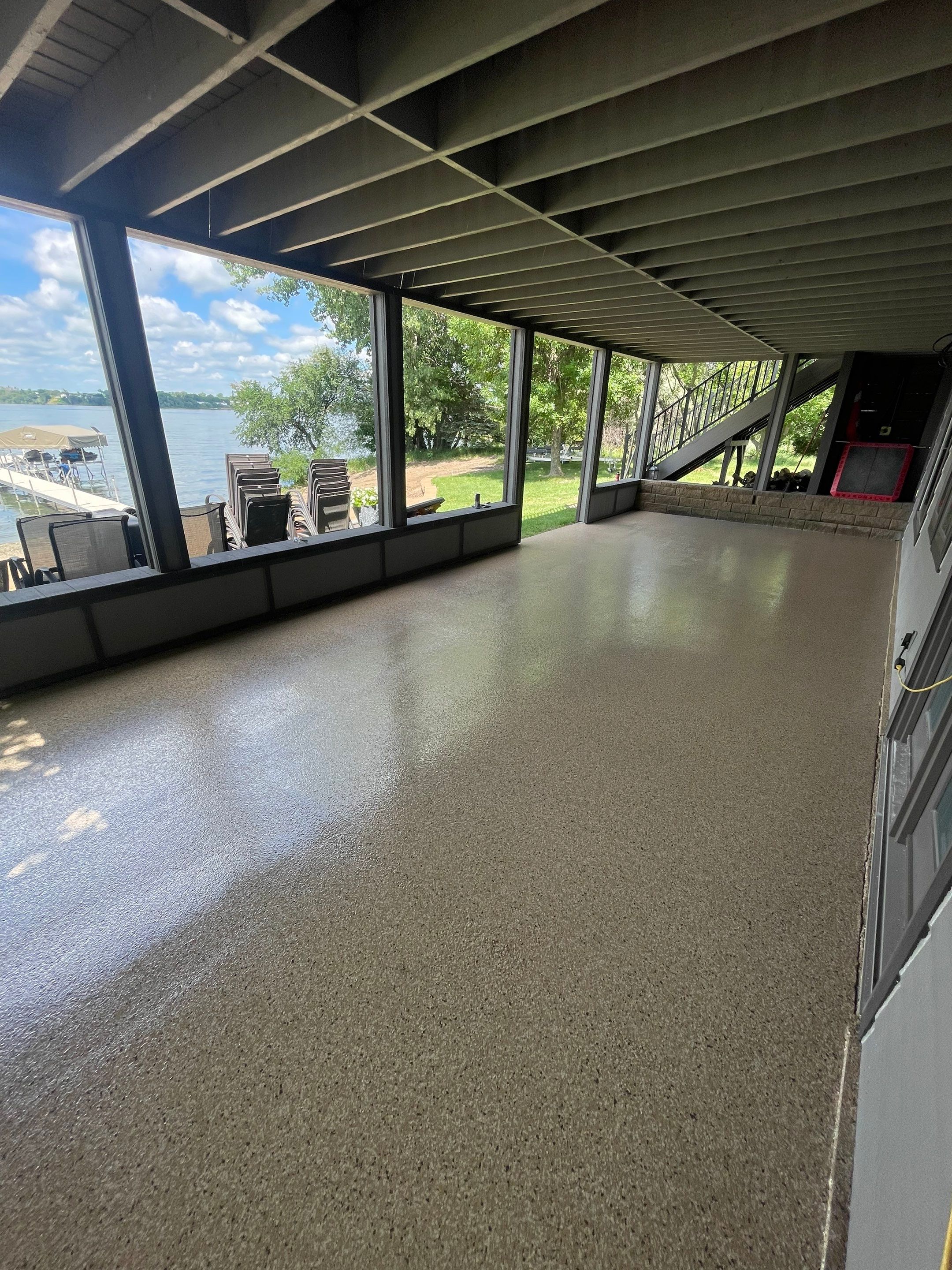 Lakefront Screened Patio Concrete Coating Installation in Wentworth by Select Painting, Coatings & Garage Cabinets