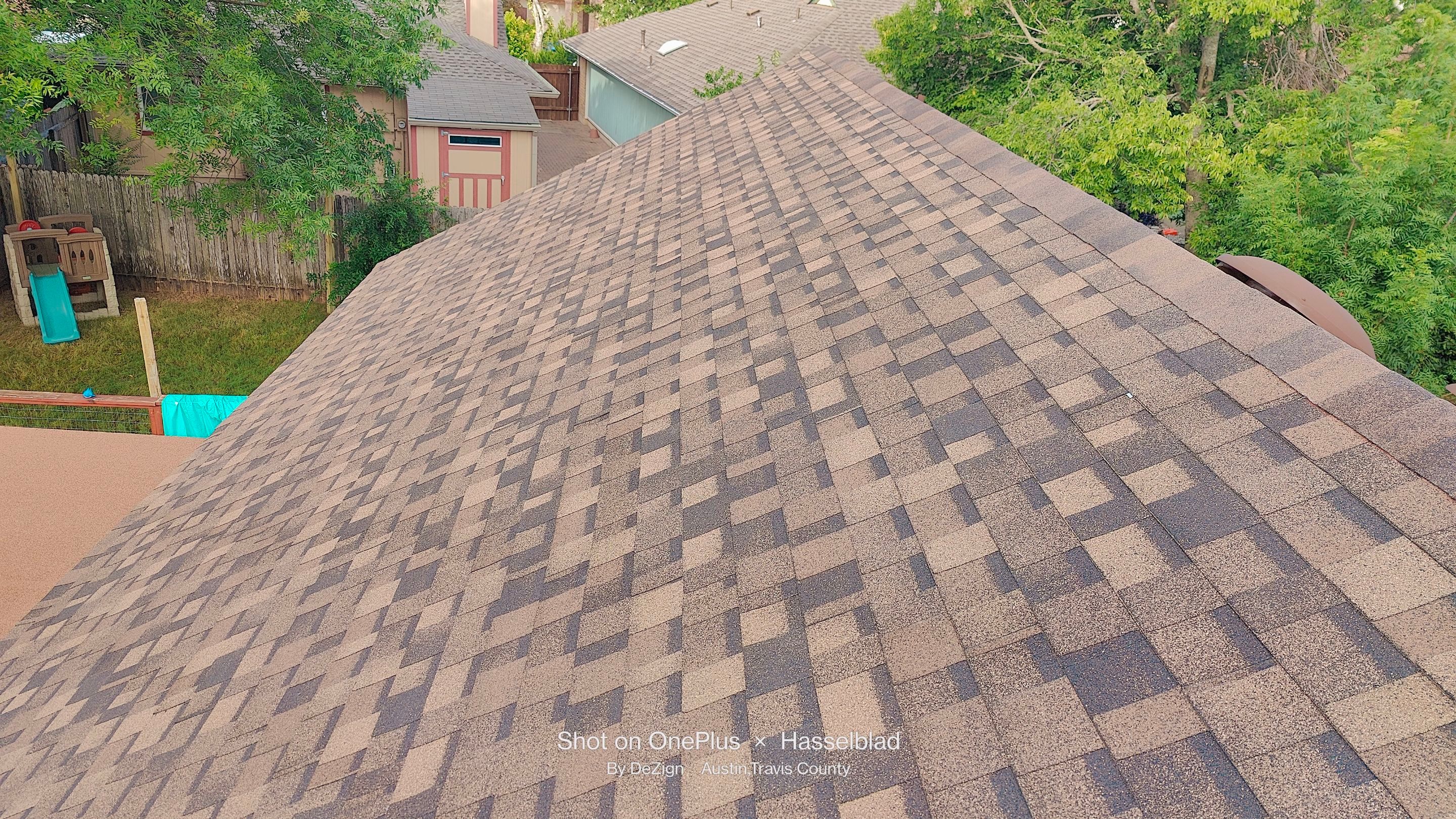 New Roof Installation Of IKO Dynasty Color Brownstone by DeZign Roofing & Exteriors