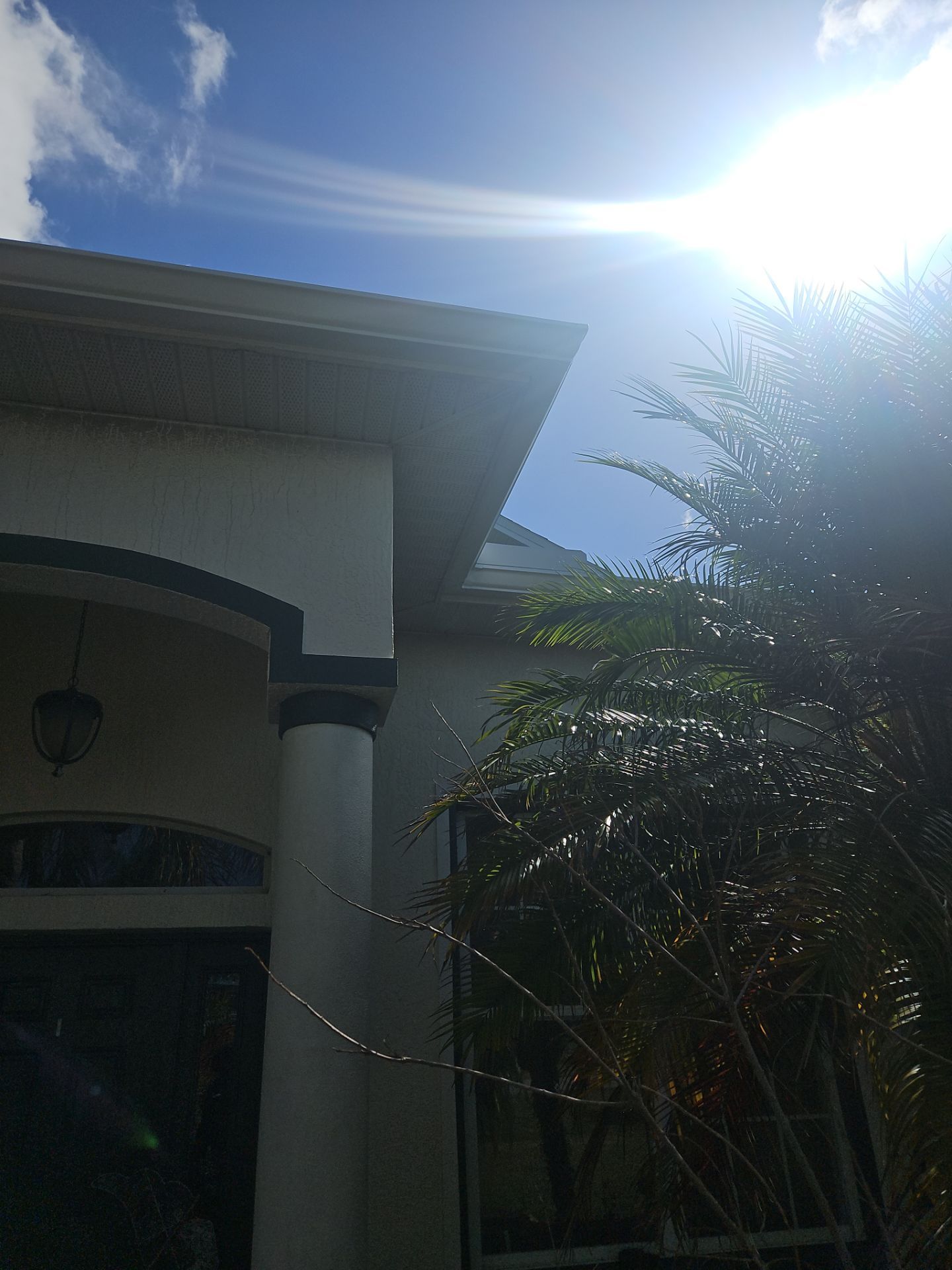 White seamless Gutters and downspout repair in Sarasota FL by Gutter Professors