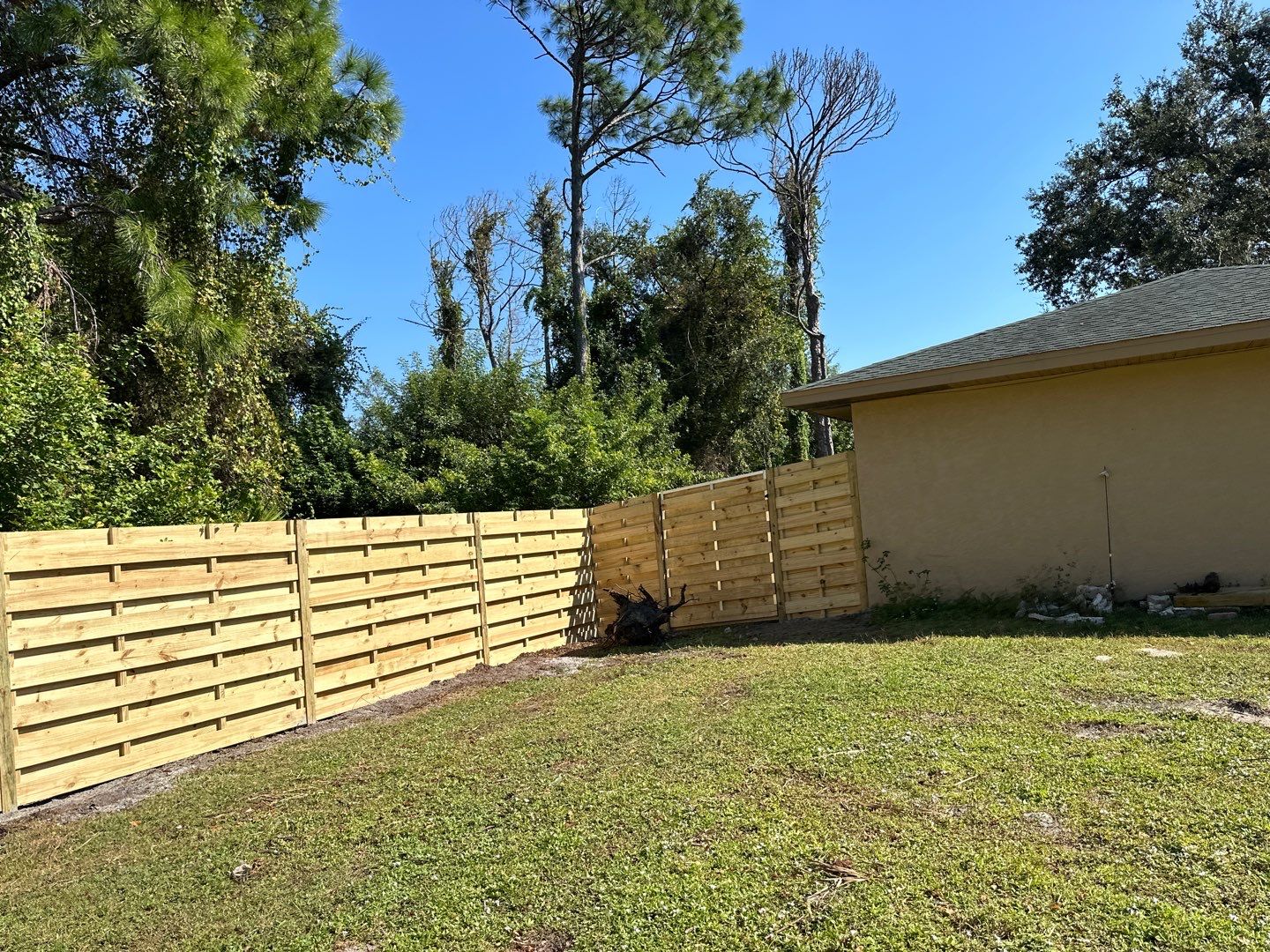 Wood Fence Installation using 6 Ft. Tall Pressure Treated Wood Shadowbox Fence by Asap fence and gates, LLC