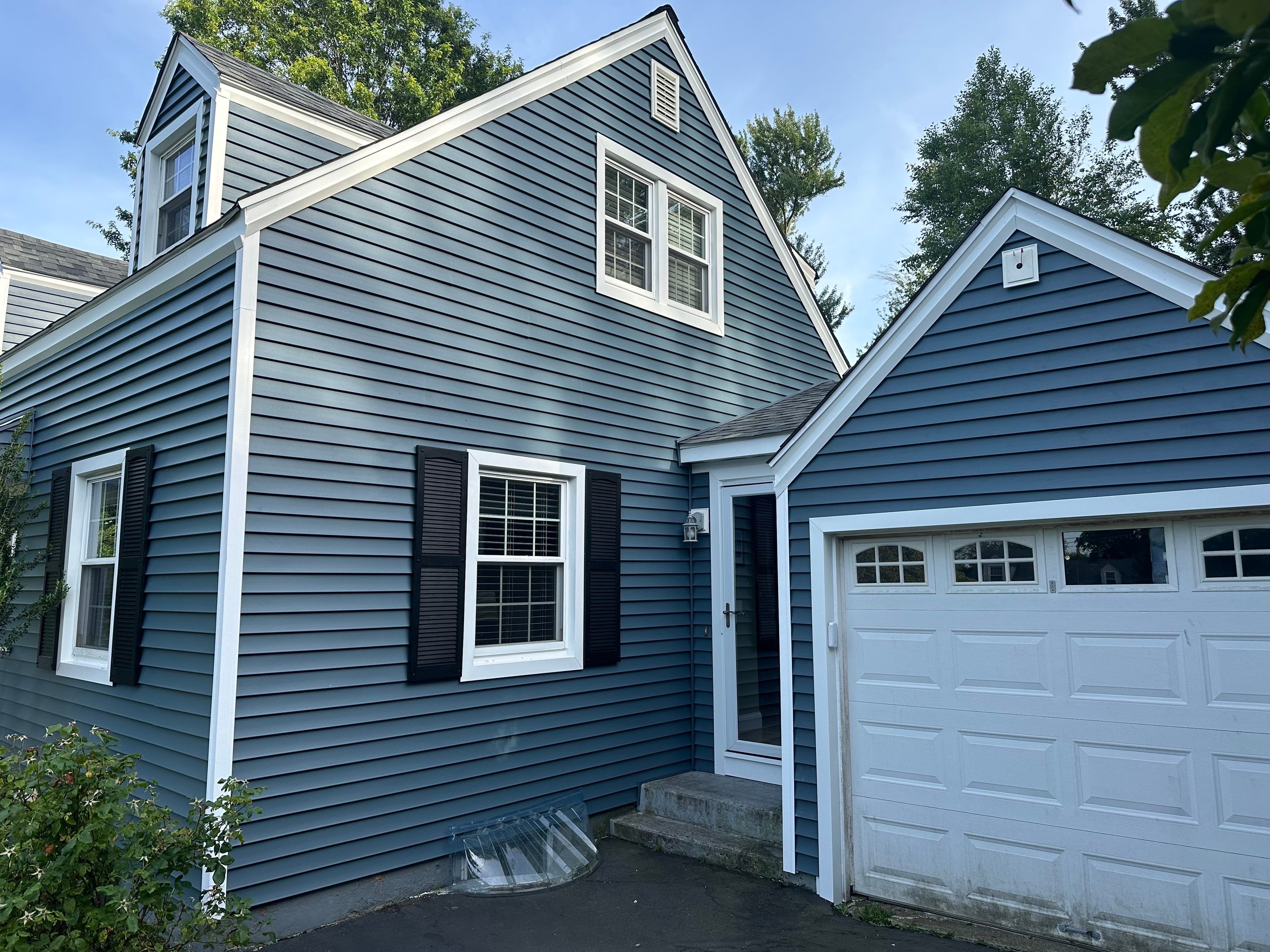 Complete Exterior Estate gray with Pacific Blue Siding by A Plus Exterior