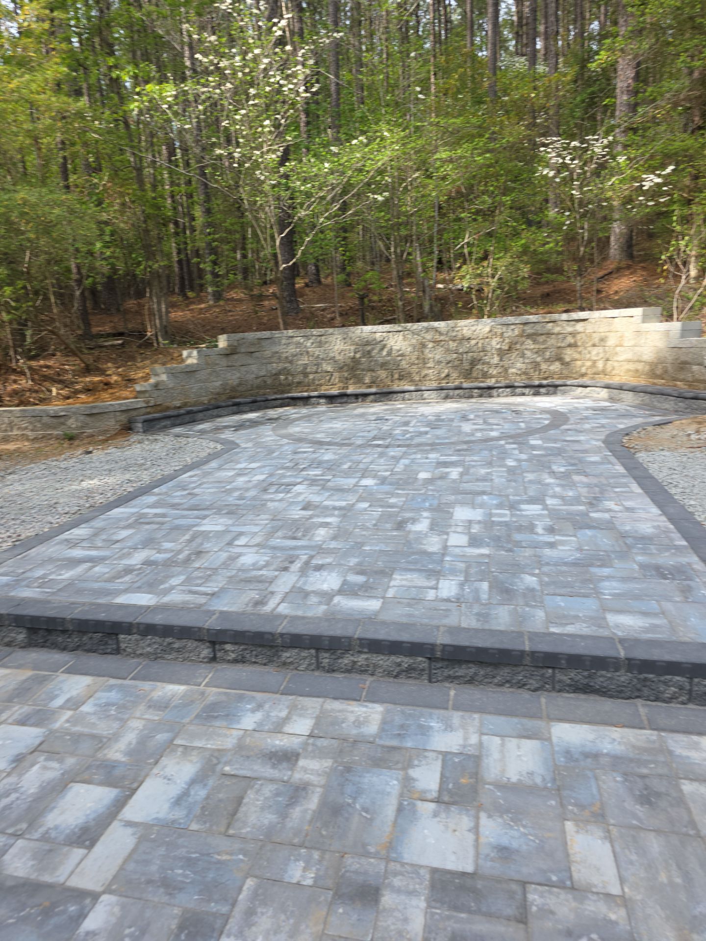 Pittsboro Outdoor Living Transformation – Retaining Wall, Paver Patio & Elevated Deck by Elite Remodeling and Design LLC