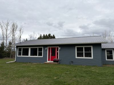 White Gutter and Downspout Installation for Boyne Falls Residential Property