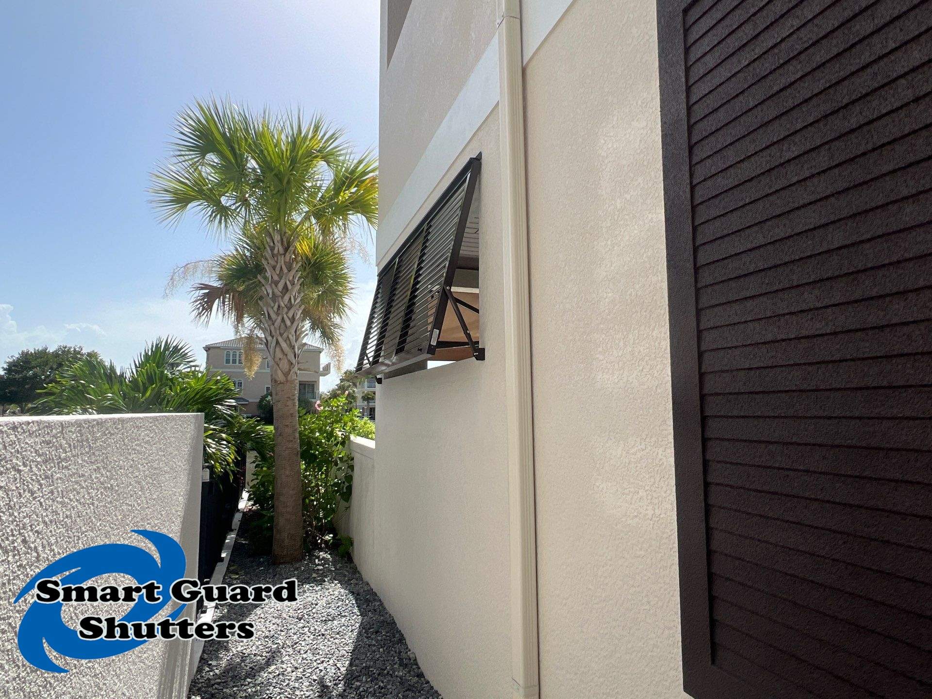 Impact Bahamas in Grey Brown  by Smart Guard Shutters
