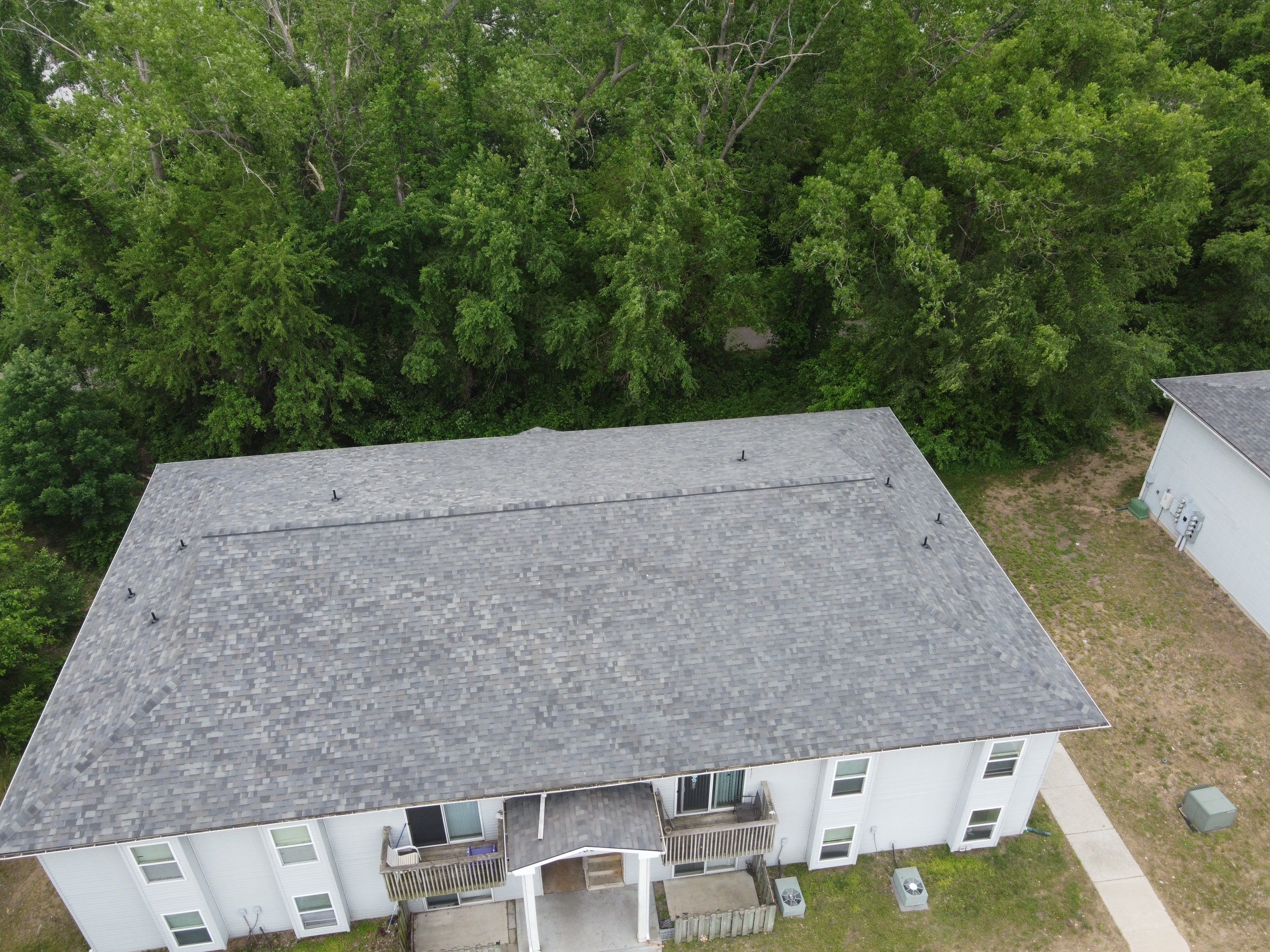 Multifamliy Complex ROOF REPLACEMNT with Ventilation Upgrades using Malarkey Vista Class III IR Shingles by Gorilla Exteriors Contracting, LLC