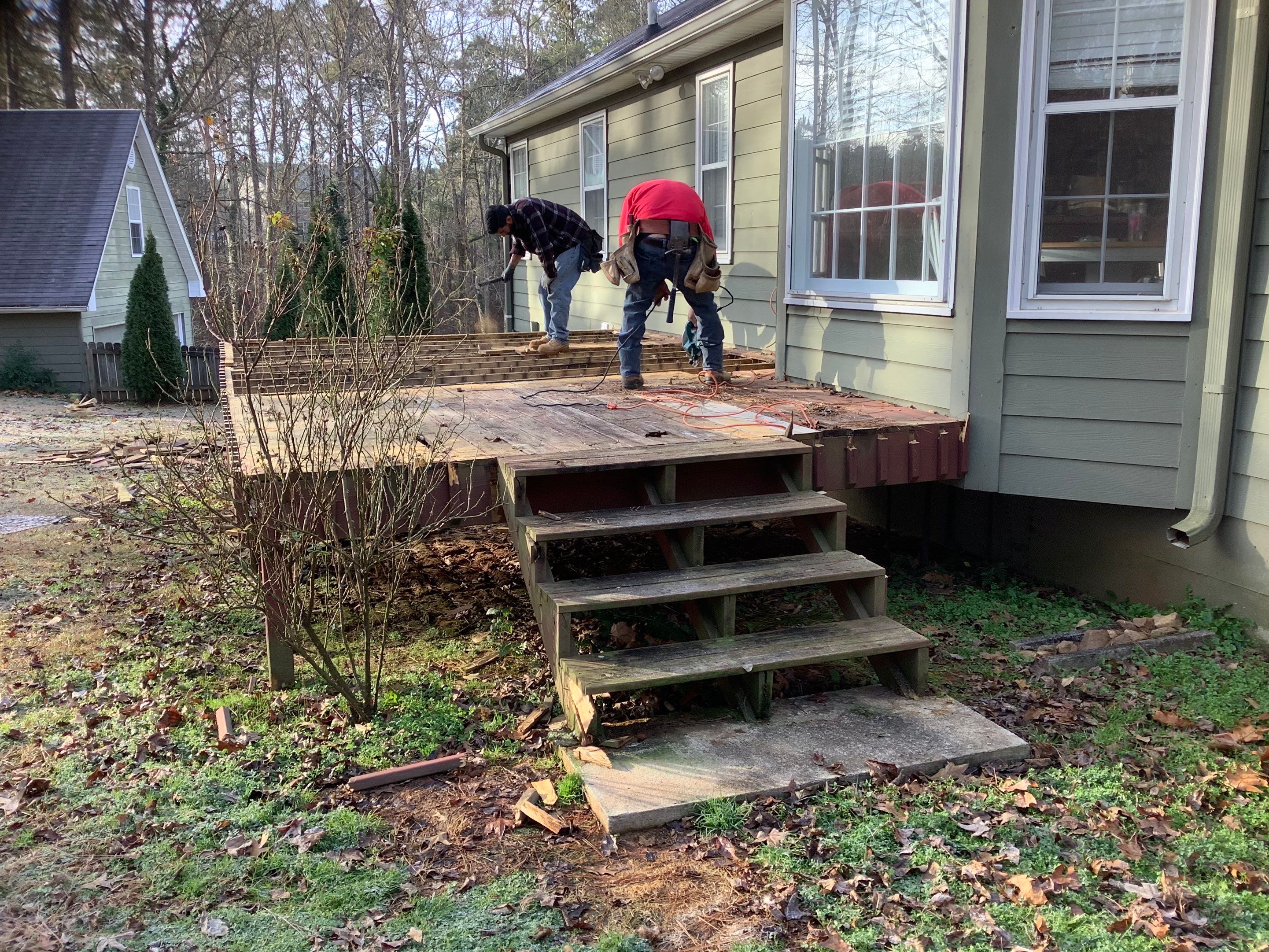 Raised Pressure-Treated Wood Deck Construction in Dallas, Georgia by Swift Home Renovations 