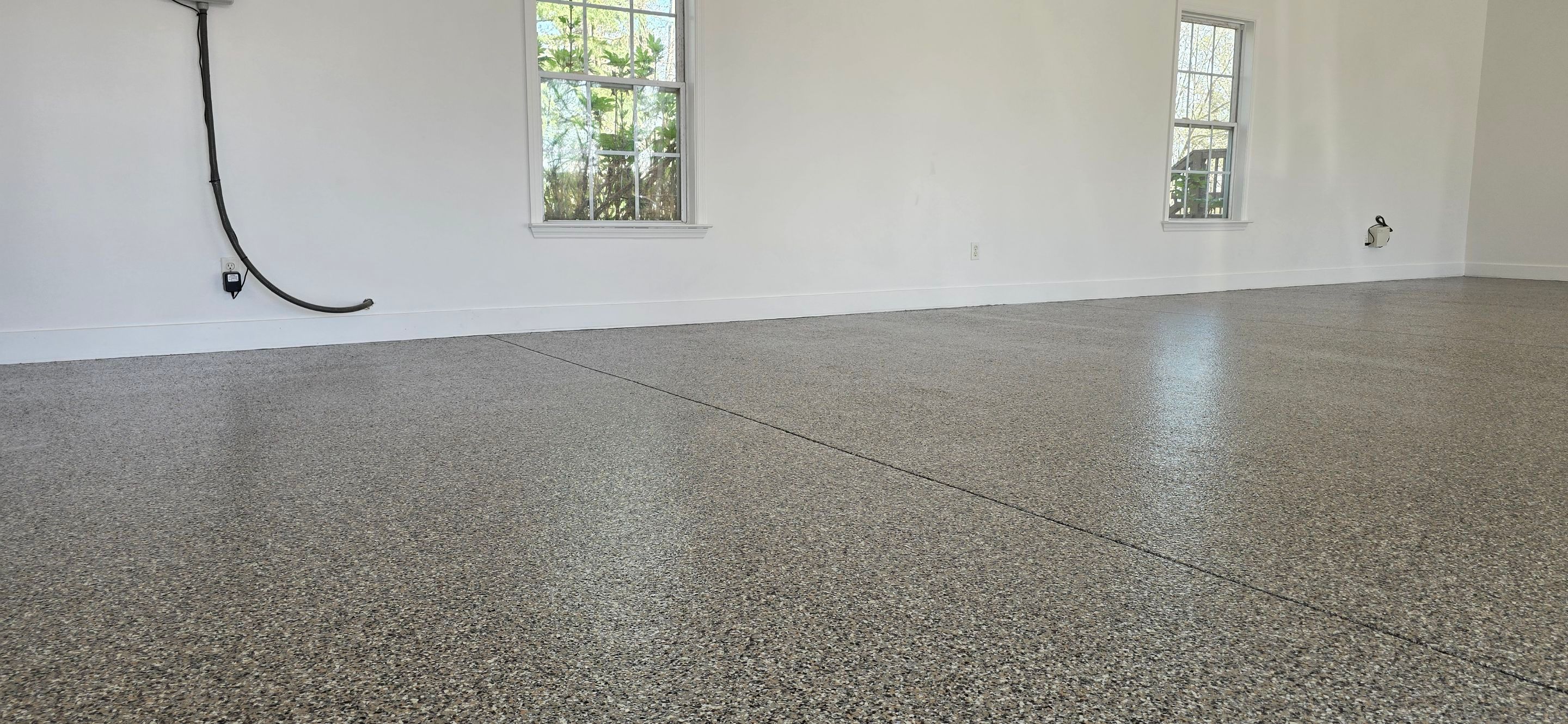 Garage Upgrade Using Custom Creekbed Blend by Elite Floor Solutions