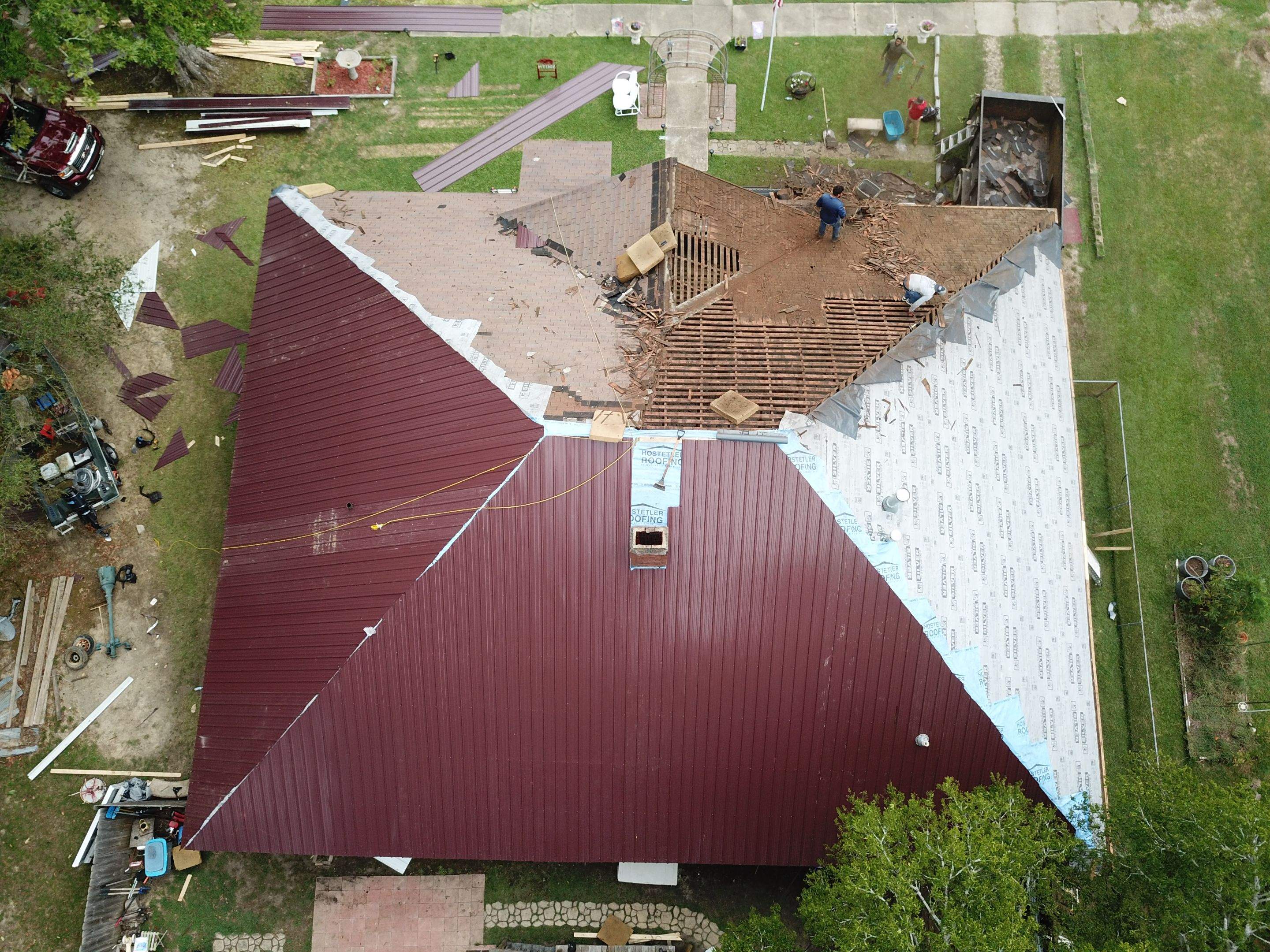 Residential Metal Roof Replacement using Reed's Metals: Colored Residental Panel (Burgundy) by Hostetler Roofing