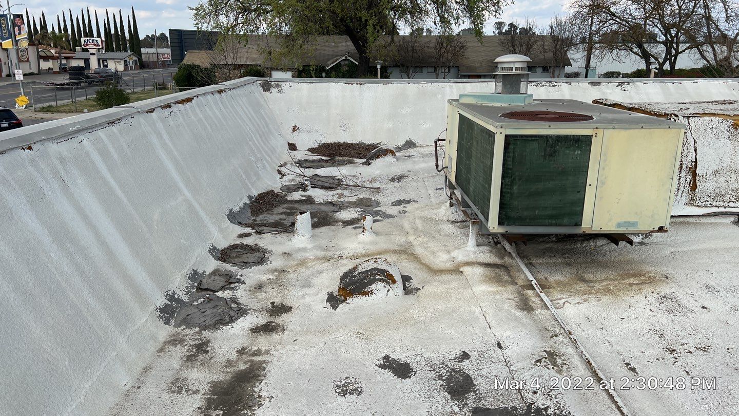 Commercial Roofing Installation using General Coatings acrylic coatings and spray foam by Straight Edge Roofing Inc