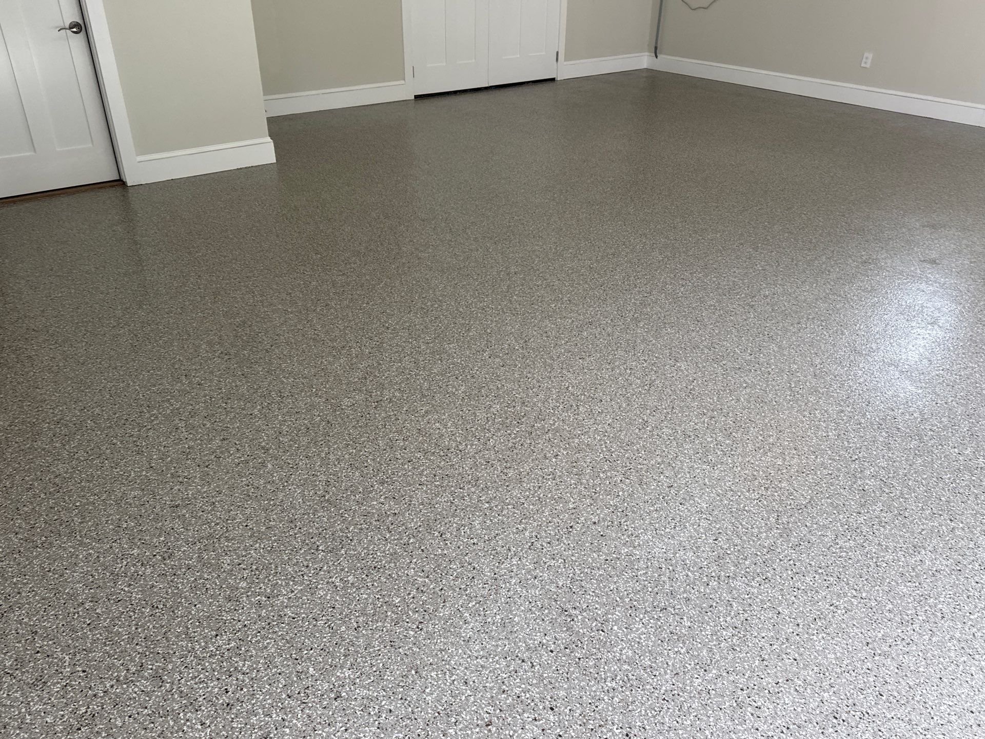 Garage and Sidewalk Project in Keystone Heights, FL in Pebble Beach by Cross Creek Concrete Coatings