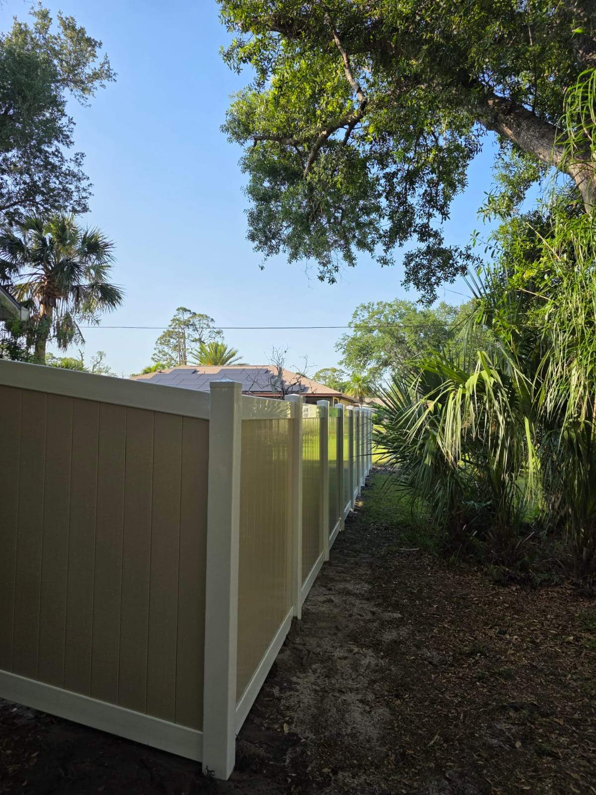 Two-Tone Vinyl Privacy Fence Installation in Port Charlotte by True Fence LLC