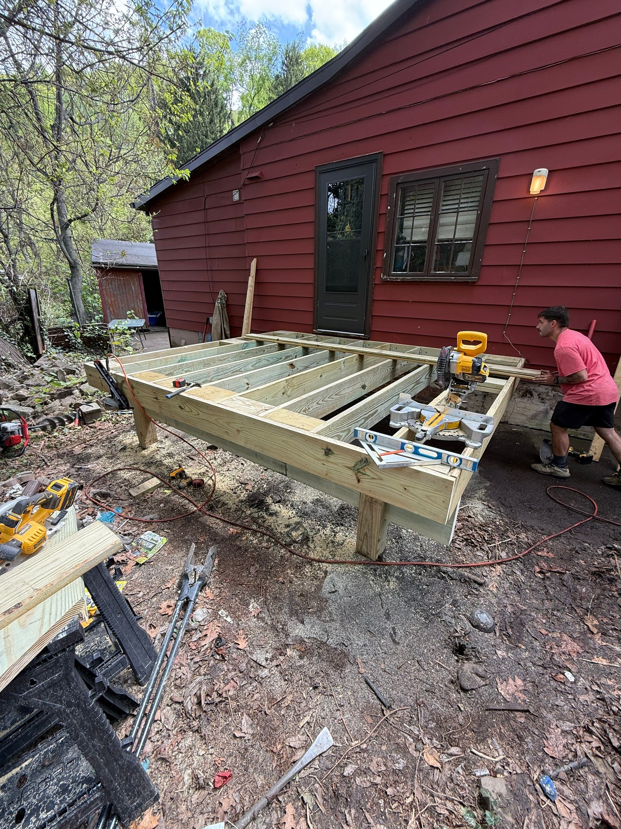 Roof sunspace deck  by Cousins Roofing Siding & Decks