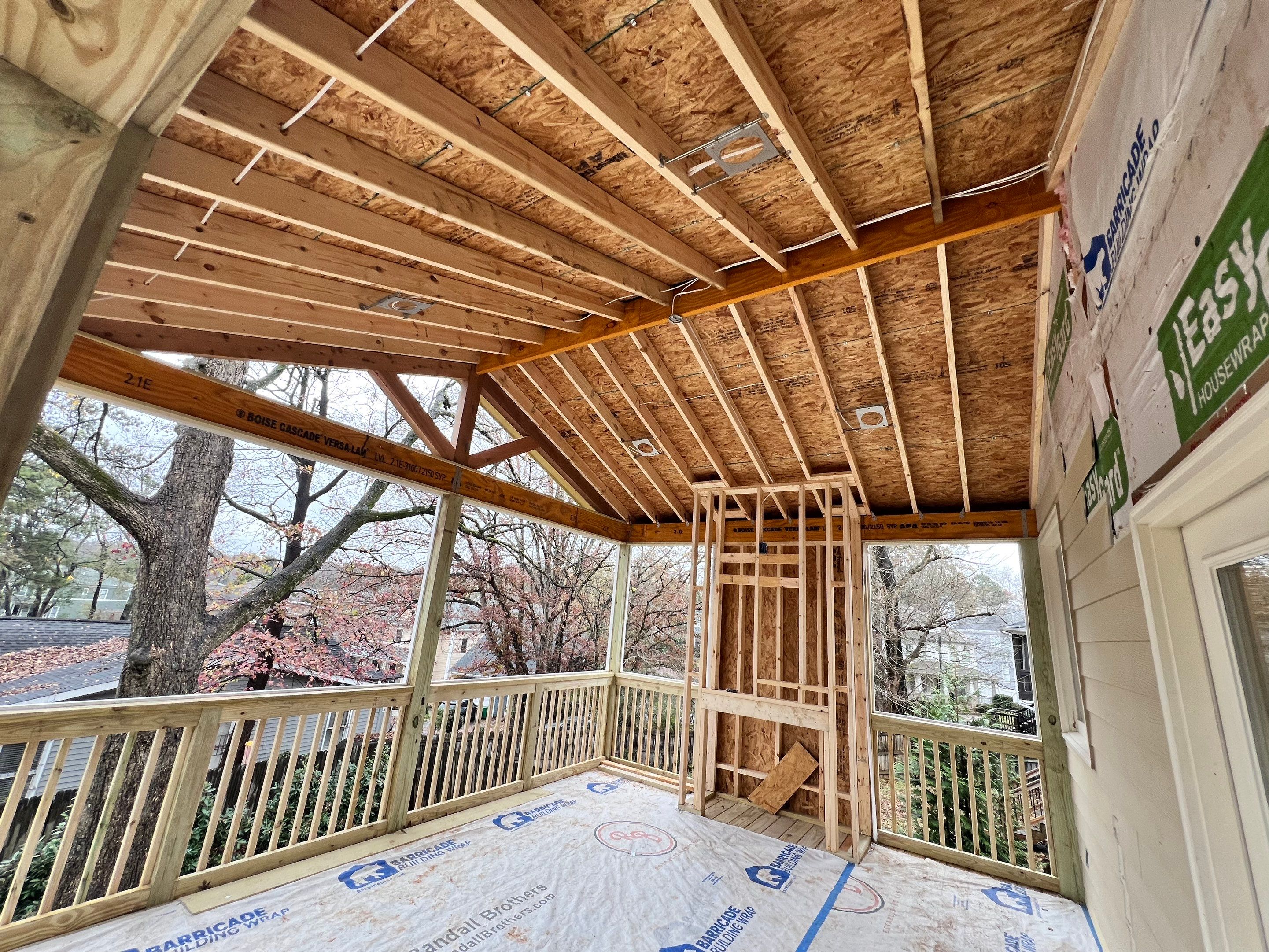 Screened-In Porch With Fireplace by Swift Home Renovations