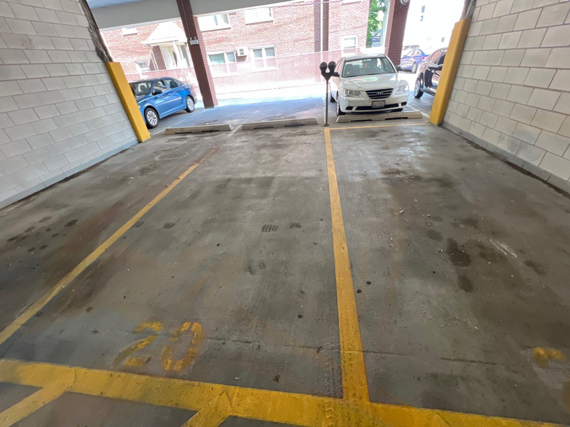 Parking garage using Hot water by Northern Power Washing LLC.