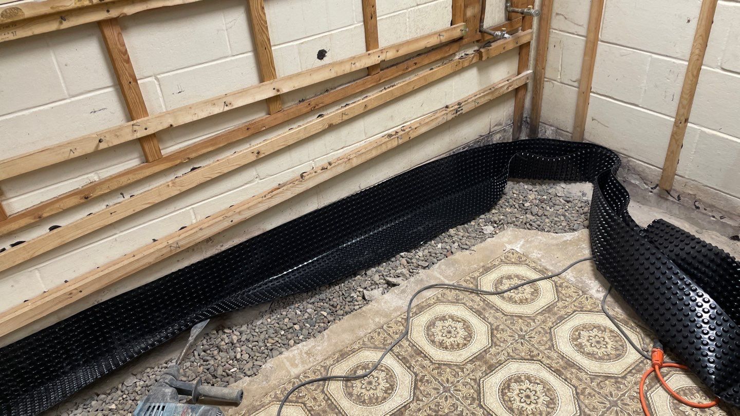 Drain Tile, Sump Pump & Buried Discharge in Columbia Heights by Waterproofing Northeast